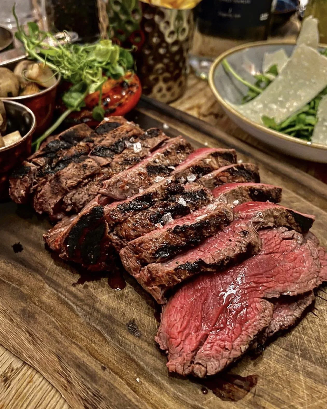 Sliced steak with salad at Branded.
