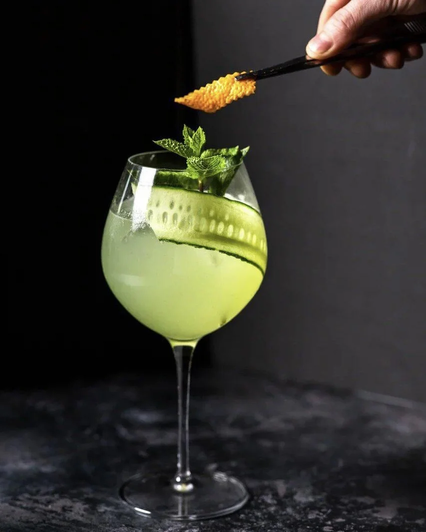 Green cocktail with cucumber and mint at Branded.
