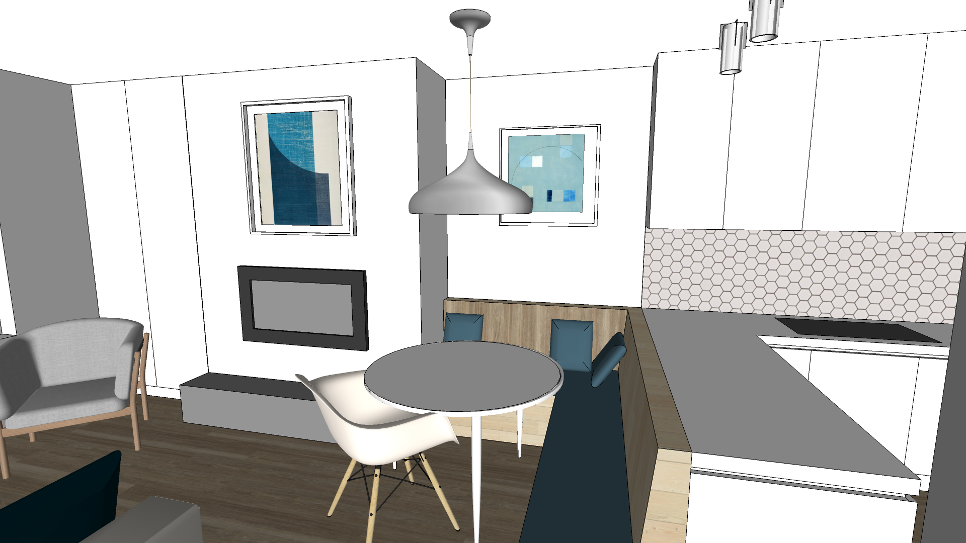 Interior view of a modern living space with a dining area showing a round table with chairs, a sofa, wall-mounted television, framed abstract artworks, and a kitchen counter with a stove, all decorated with contemporary furniture and design.