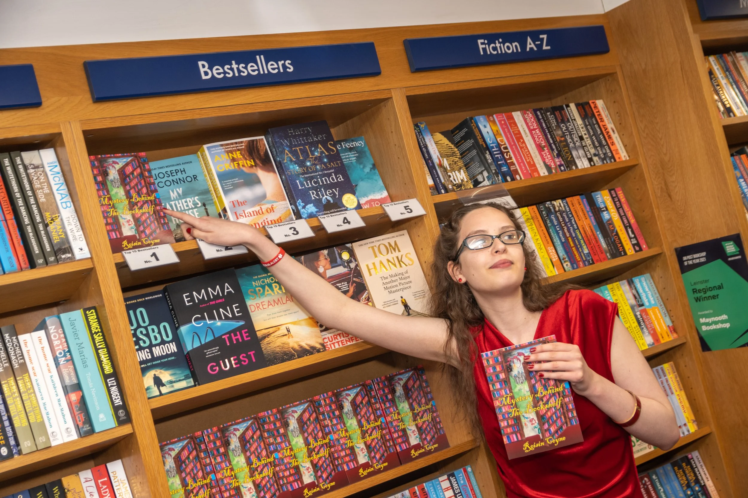 Writer Roisin Coyne with her soon to be best seller, Mystery Behind the Bookshelf.jpg