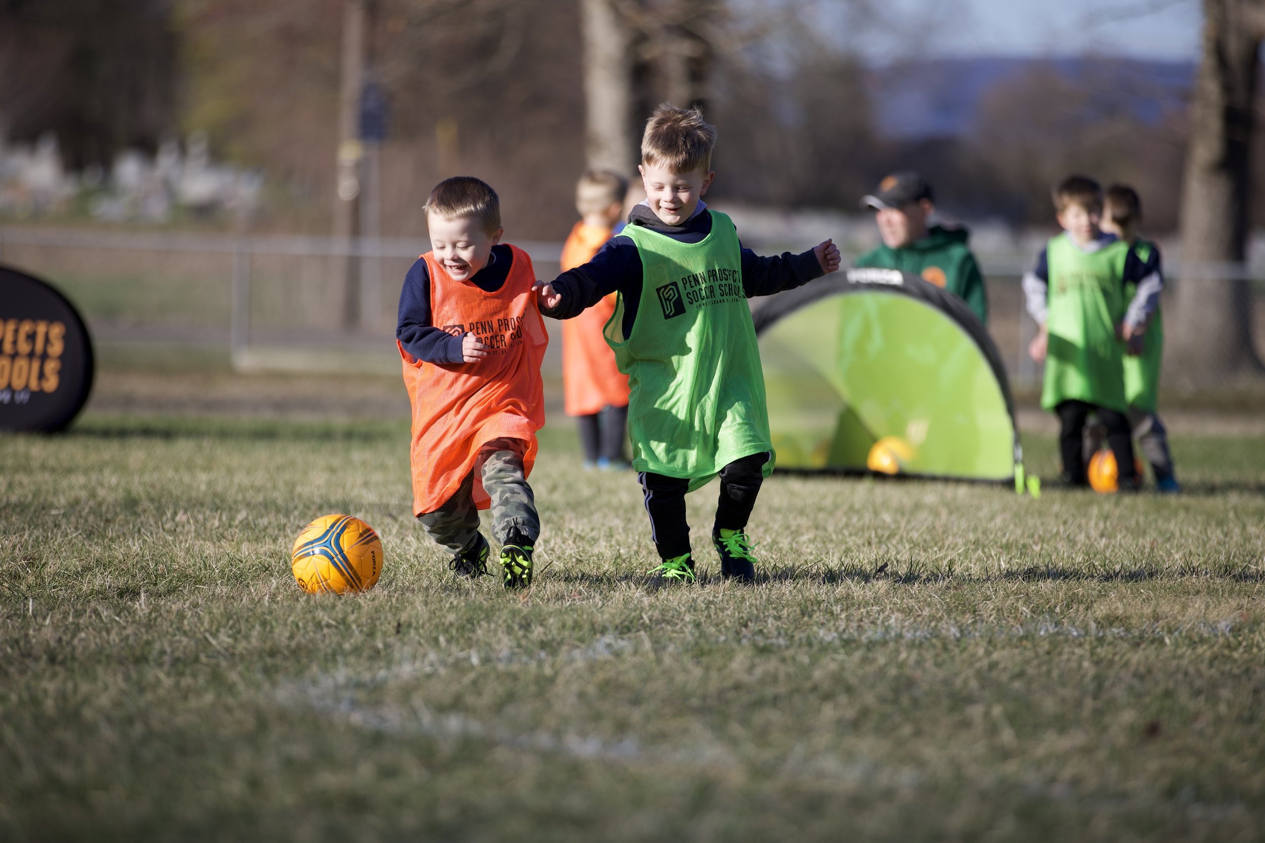 Two young soccer players playin 1 v 1