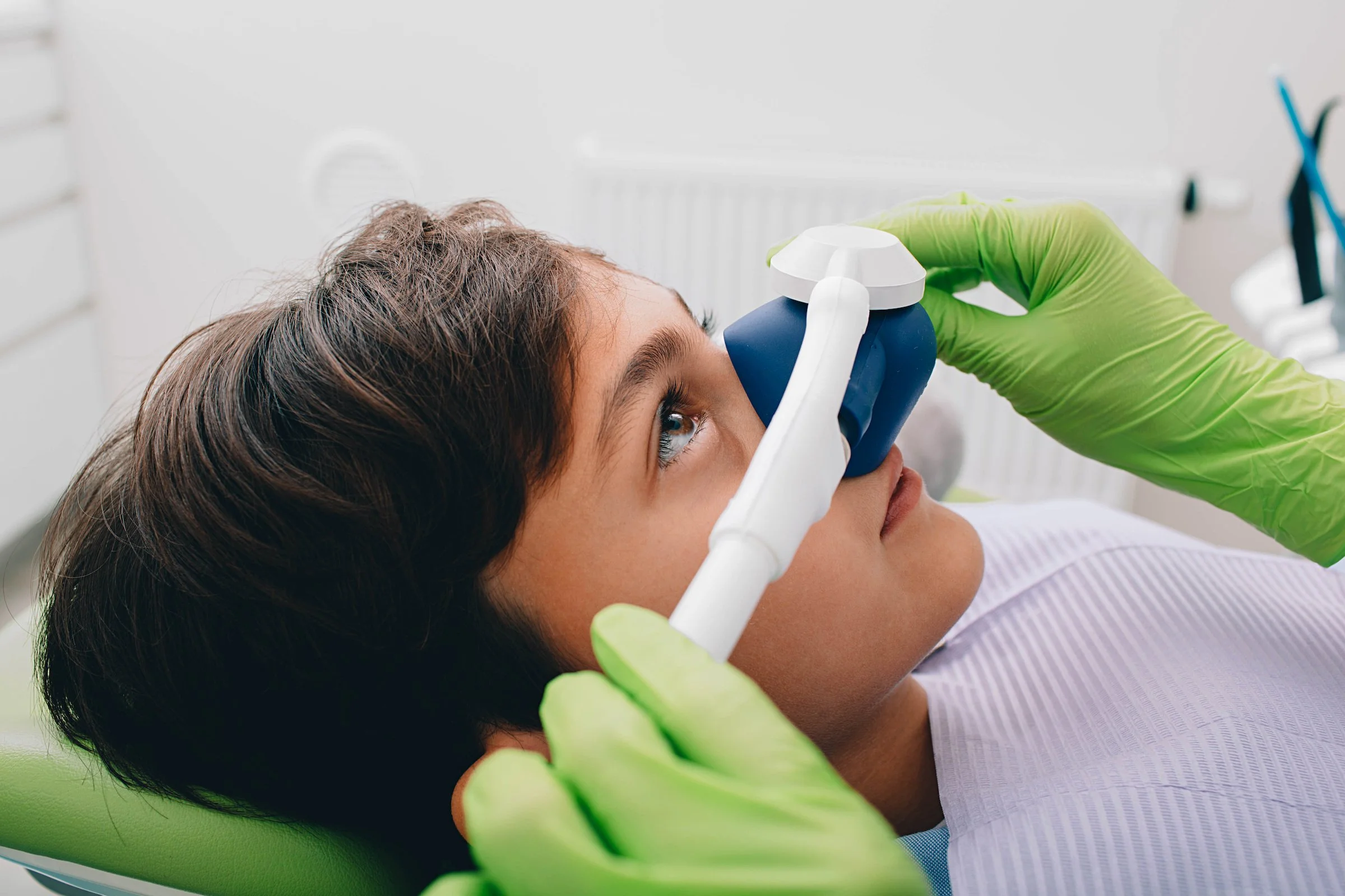 Child being sedated at the dentist.