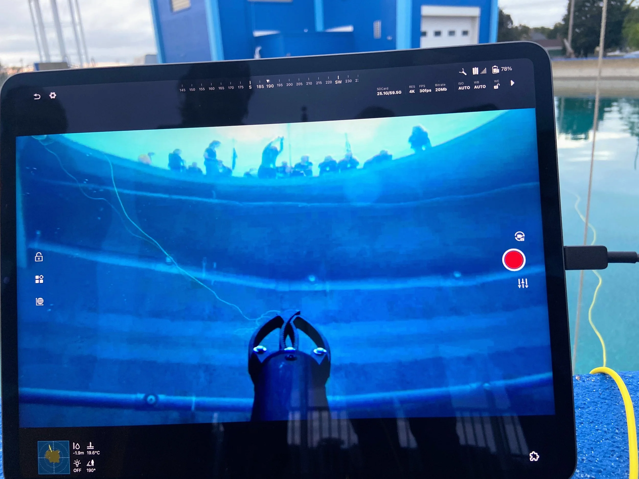  A submersible camera snaps a group photo from inside NOAA’s test tank used for testing equipment to study water chemistry and shipwreck history. 