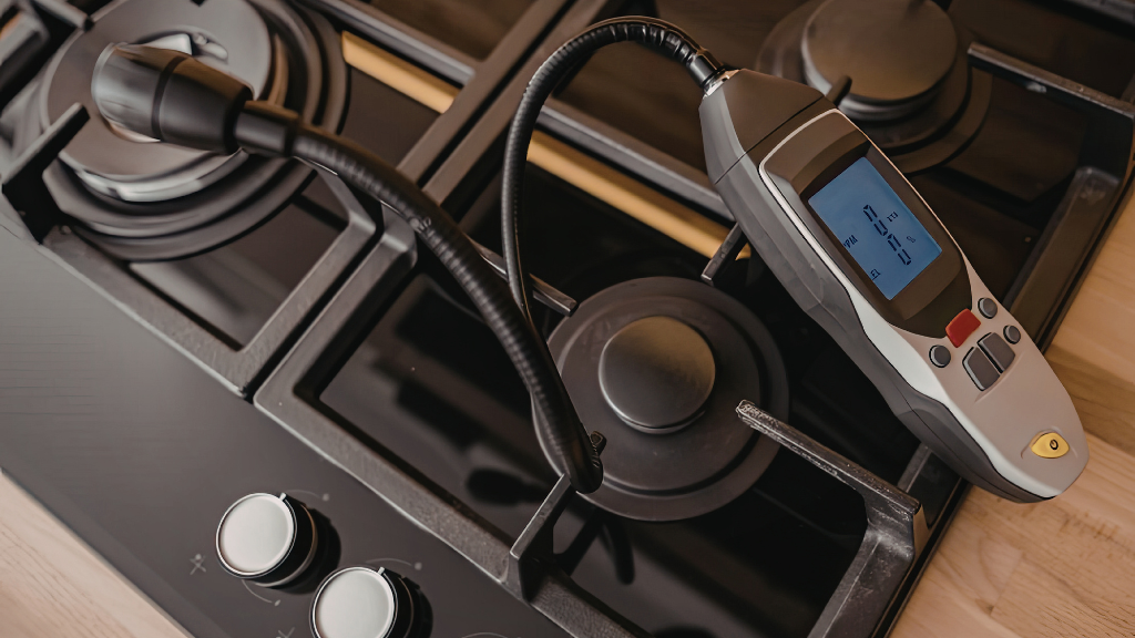An old abandoned water tower surrounded by trees during sunset.