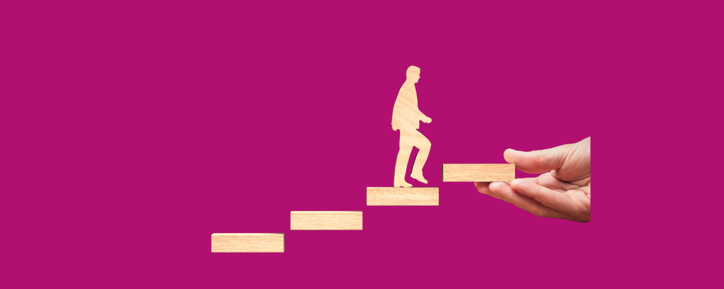 Wooden figure of a person climbing staircase made of blocks, with a hand placing the next step, symbolizing support and progress in leadership development. Bold magenta background.