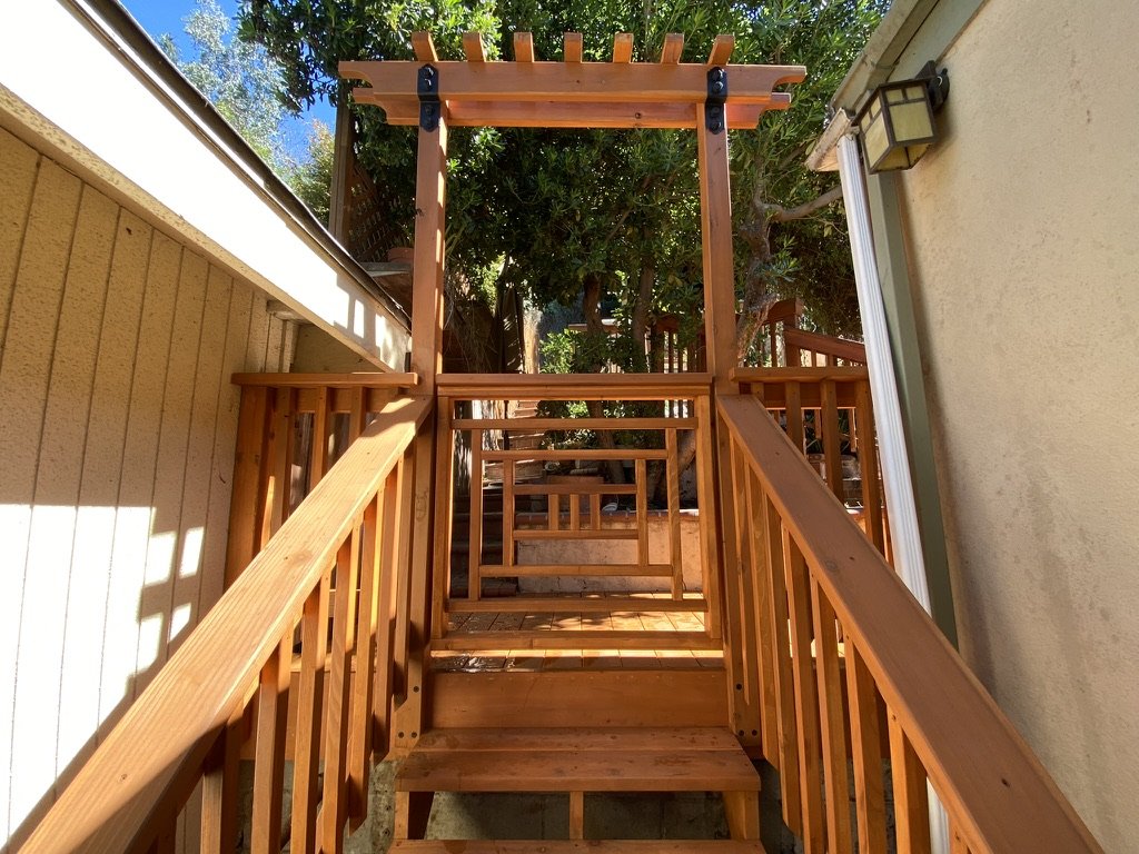 Redwood Stairs with Railing and Arbor Over Gate