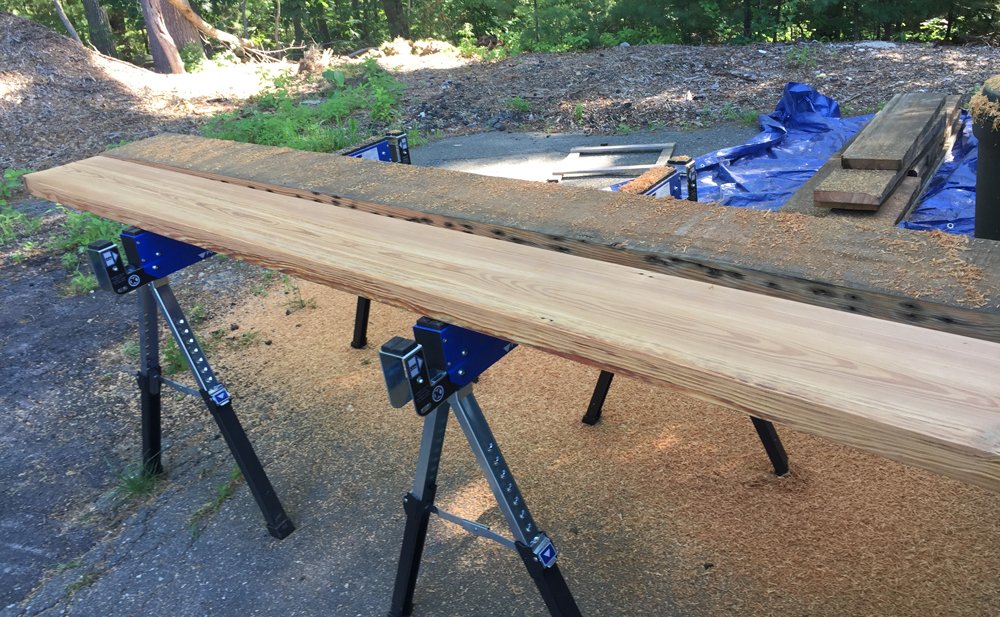 Each board needed to be hand plained on all sides. You can see the original nail holes on the side of the wood.