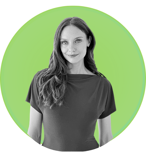Black and white portrait of a woman with long wavy hair wearing a dark shirt, standing in front of a green circular background.