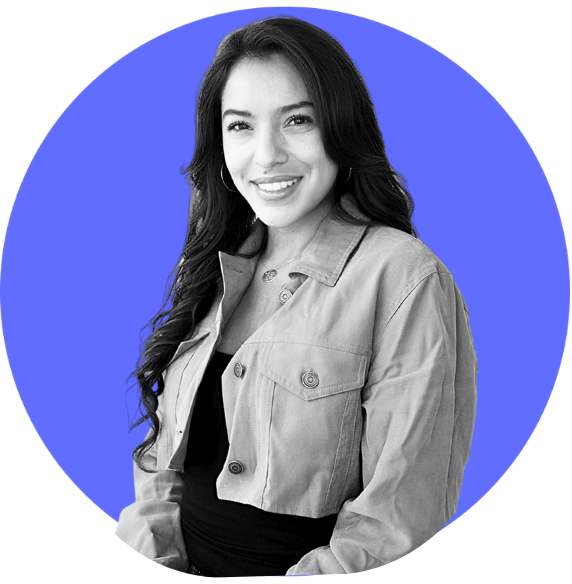 A smiling woman with long dark hair, wearing a light-colored jacket over a black top, against a blue circular background.