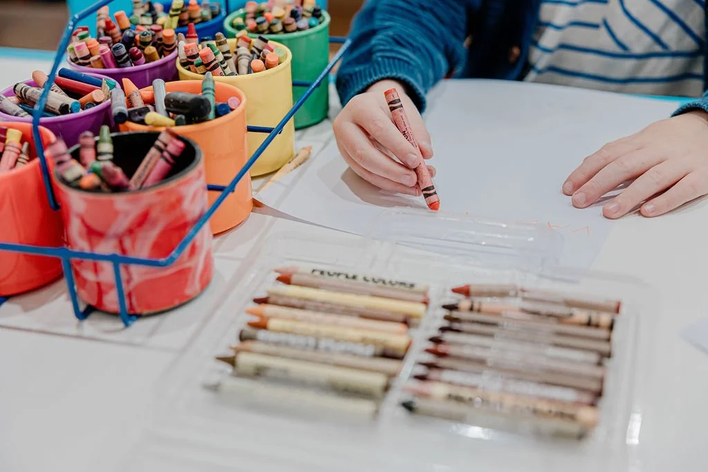 Children using crayons in a classroom at Chandlers Preschool in Highland Park, Ca. 