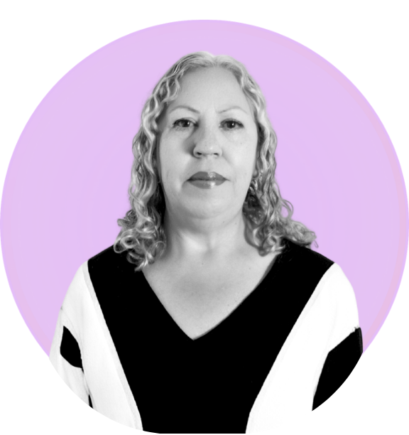 Black and white portrait of a woman with curly hair wearing a black and white top, against a light purple circular background.