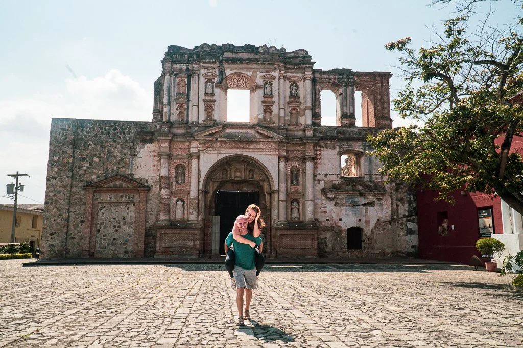 Cute couple in Antigua Guatemala in front of a ruined church