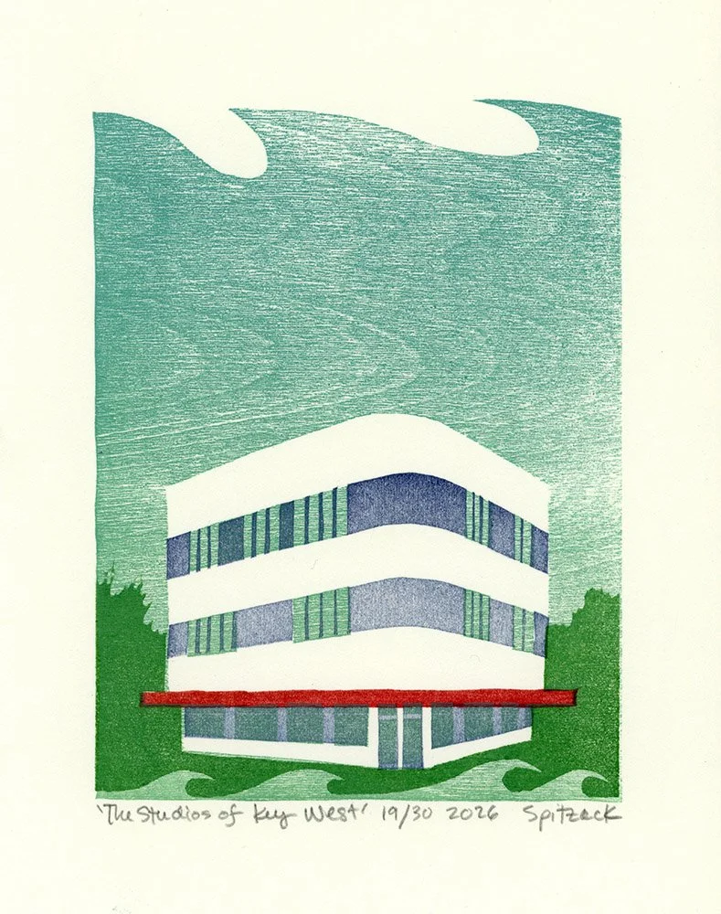 A modern multi-story building with curved balconies and large windows, surrounded by greenery, under a sky with textured clouds. Handwritten note at the bottom: "The Studios of Key West! 19/30 2026 Spitzack." by Charles Spitzack