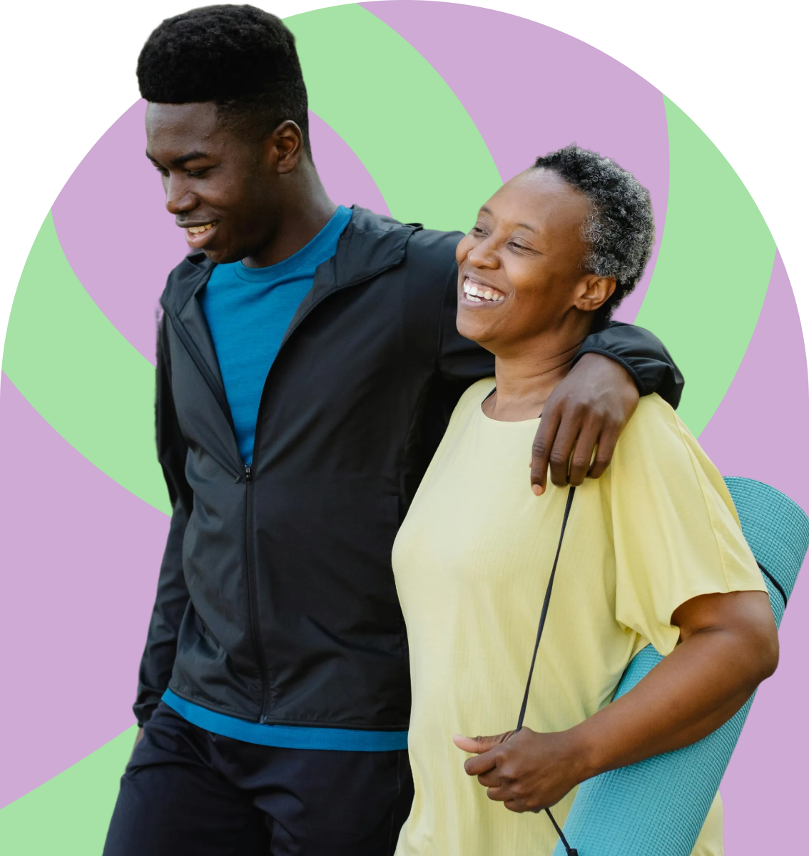 A young man with his arm around a smiling older woman carrying a yoga mat