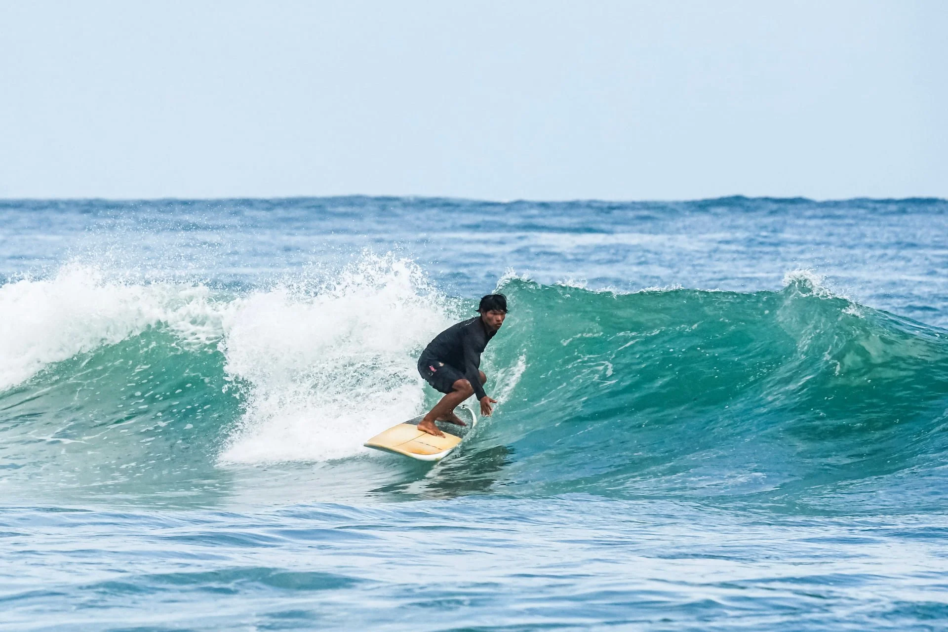 Surf instructor surfing in Bocas del Toro Panama