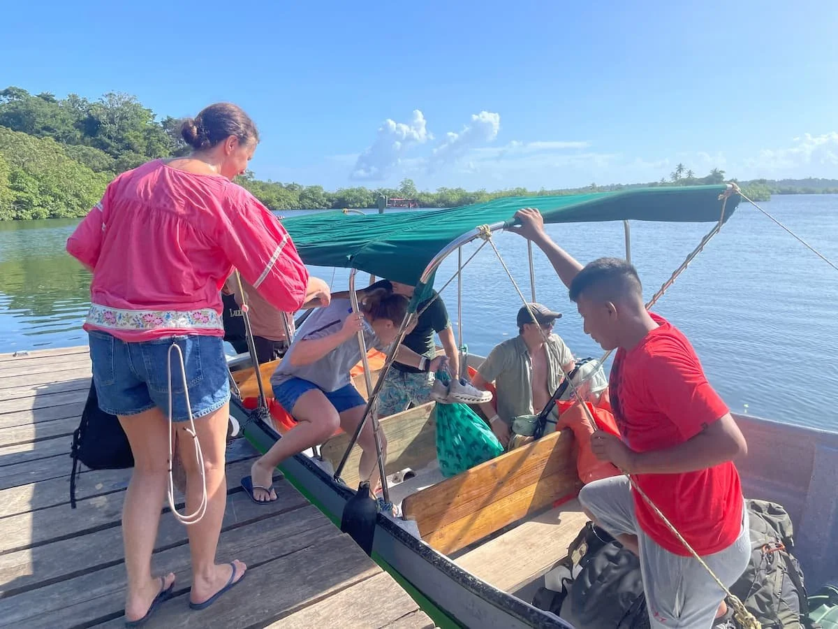 Family group getting their local transportation from red frog to carenero island with The Experience Surf Camp at Bocas del Toro Panama