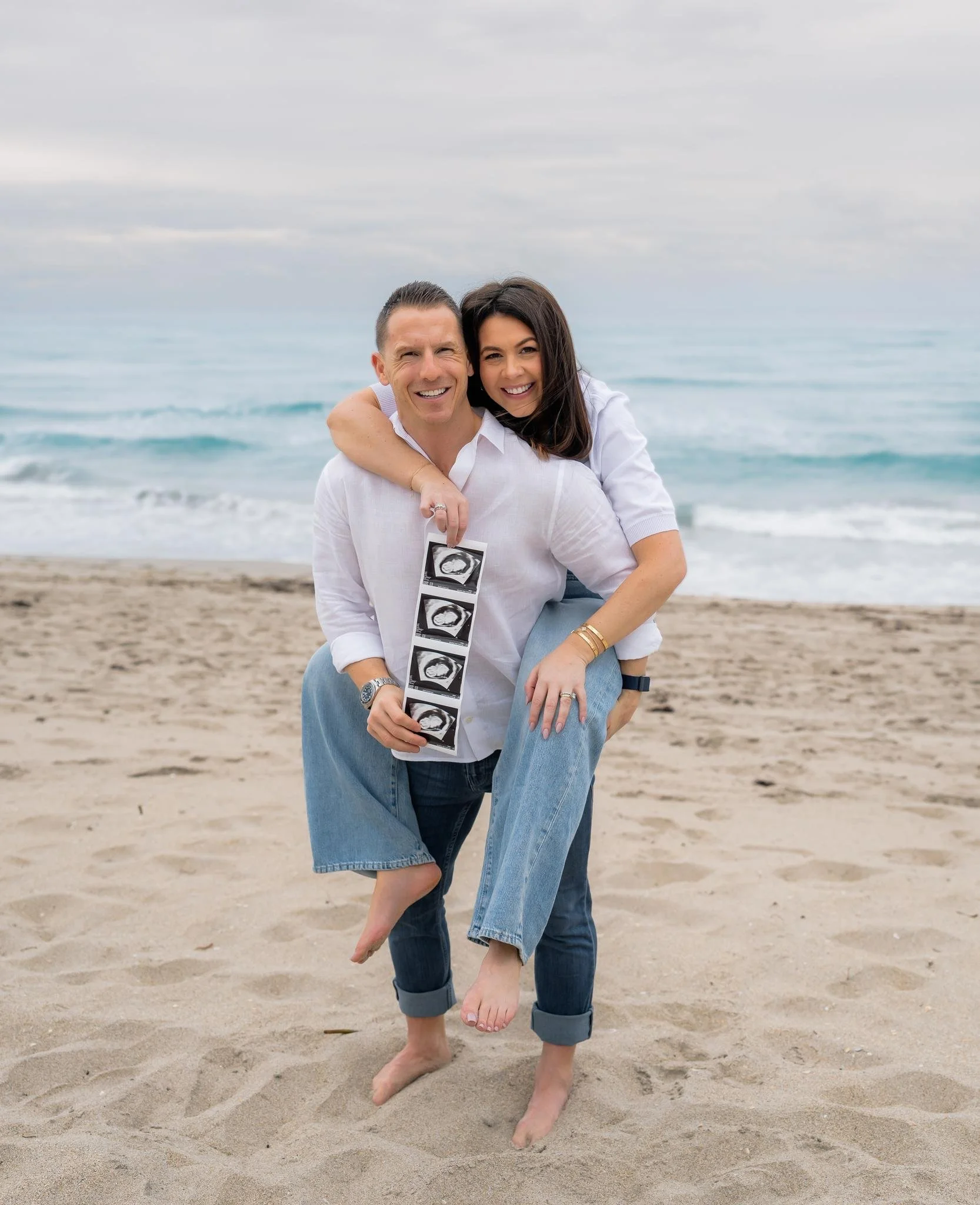 Addie Bell Zackon, Brandon Zackon, and an ultrasound photo of Baby Zackon on the beach