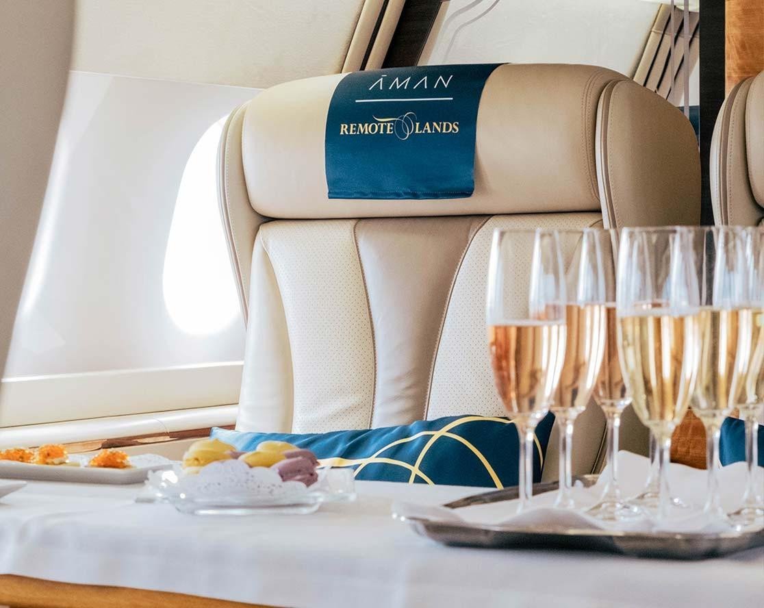 Inside the Aman Jet with an array of foods and champagne