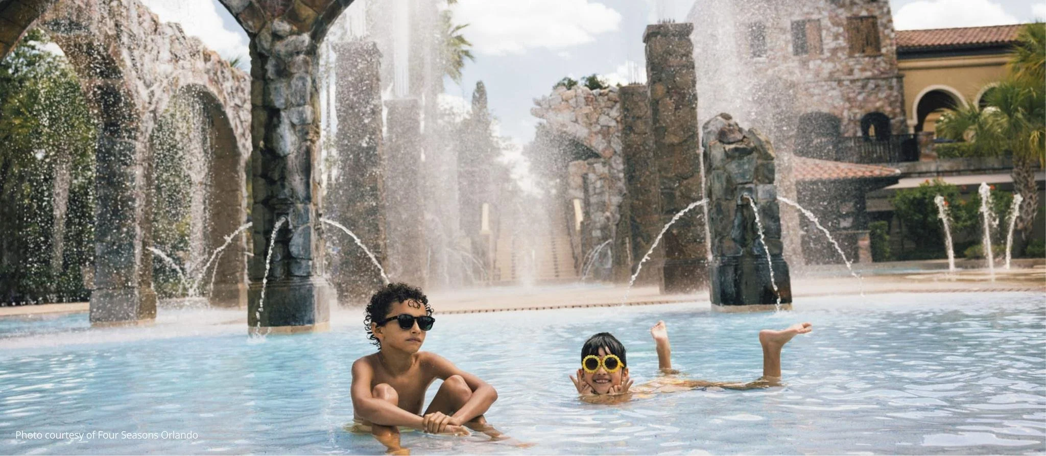Two children enjoying the pool at the Four Seasons in Orlando