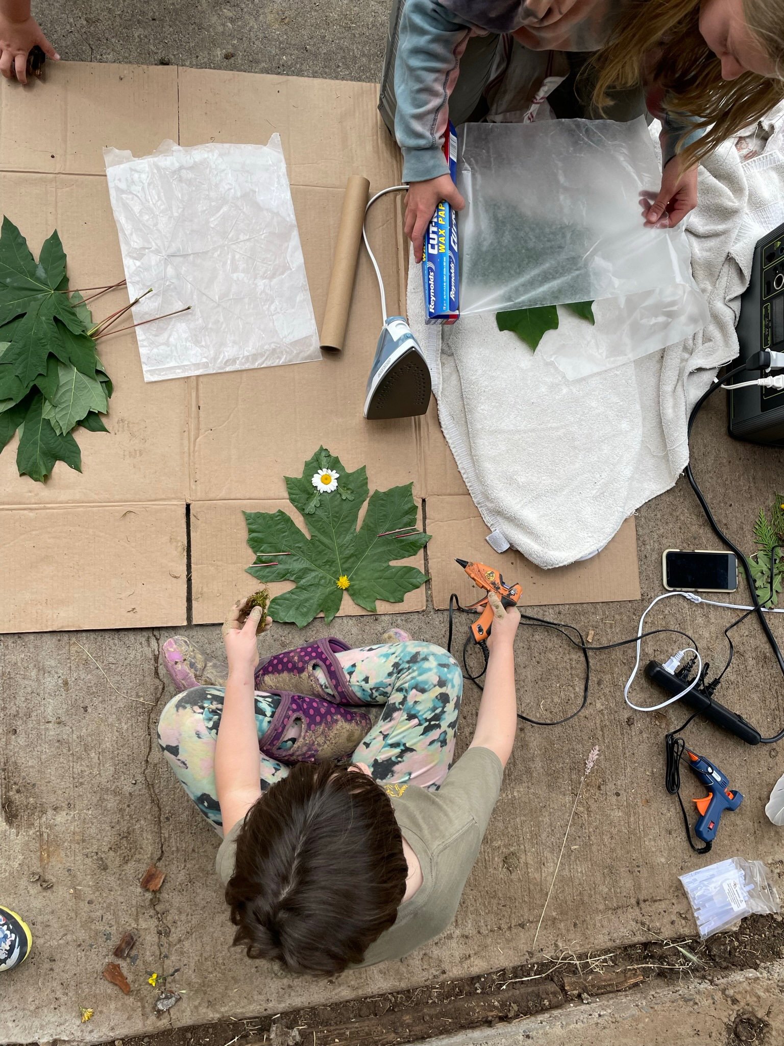 Campers made animal masks from found materials and bigleaf maple leaves.