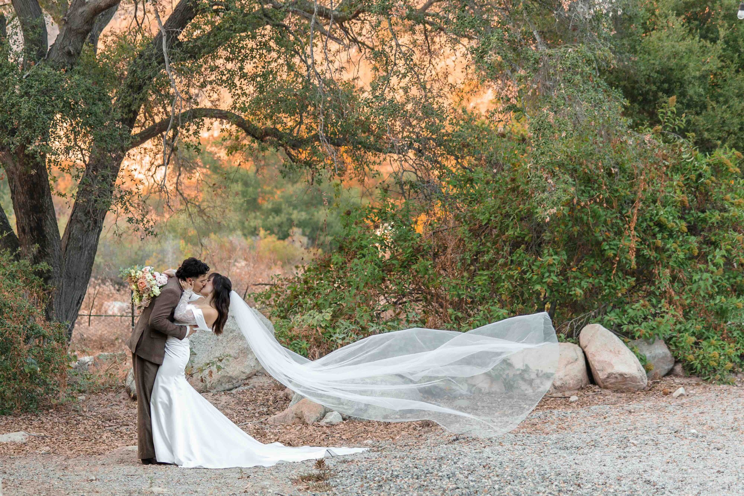 bride-groom-kissing-enchanted-hills