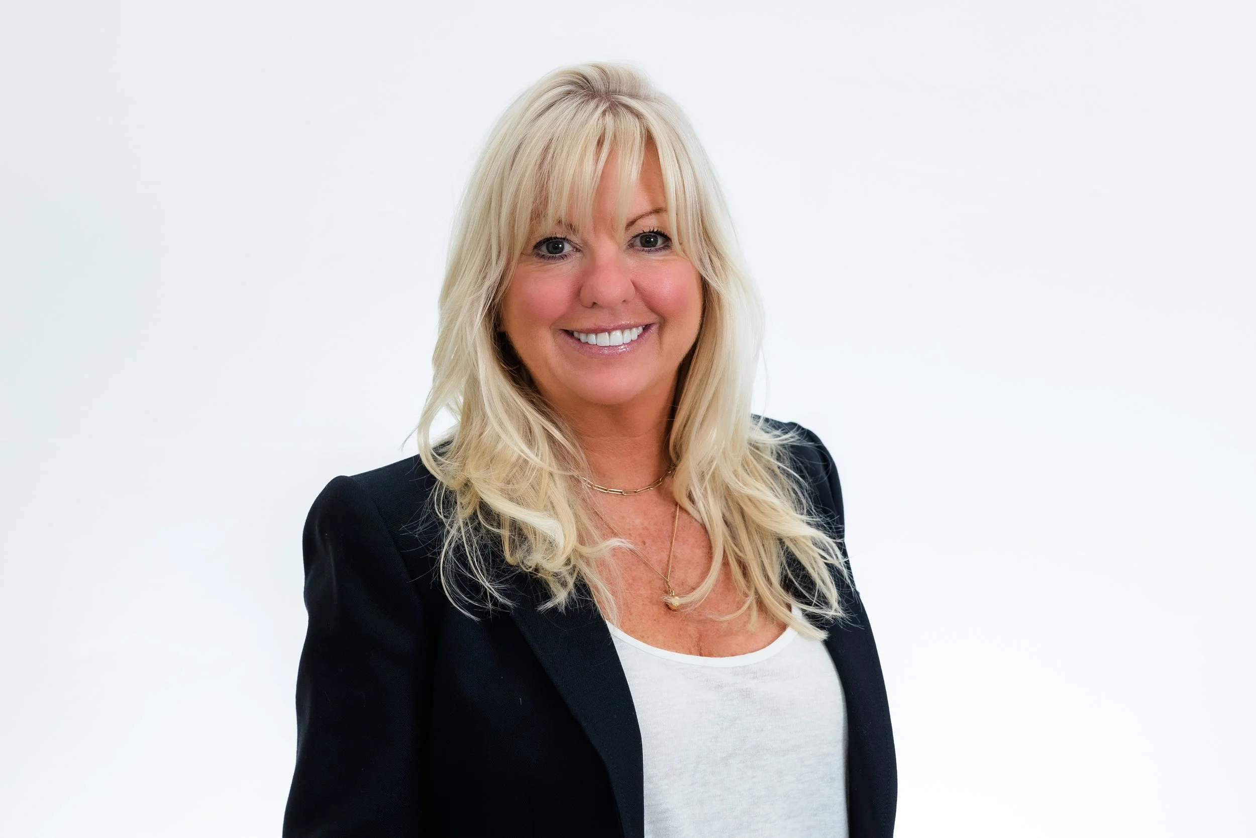 blond woman in black blazer.jpg