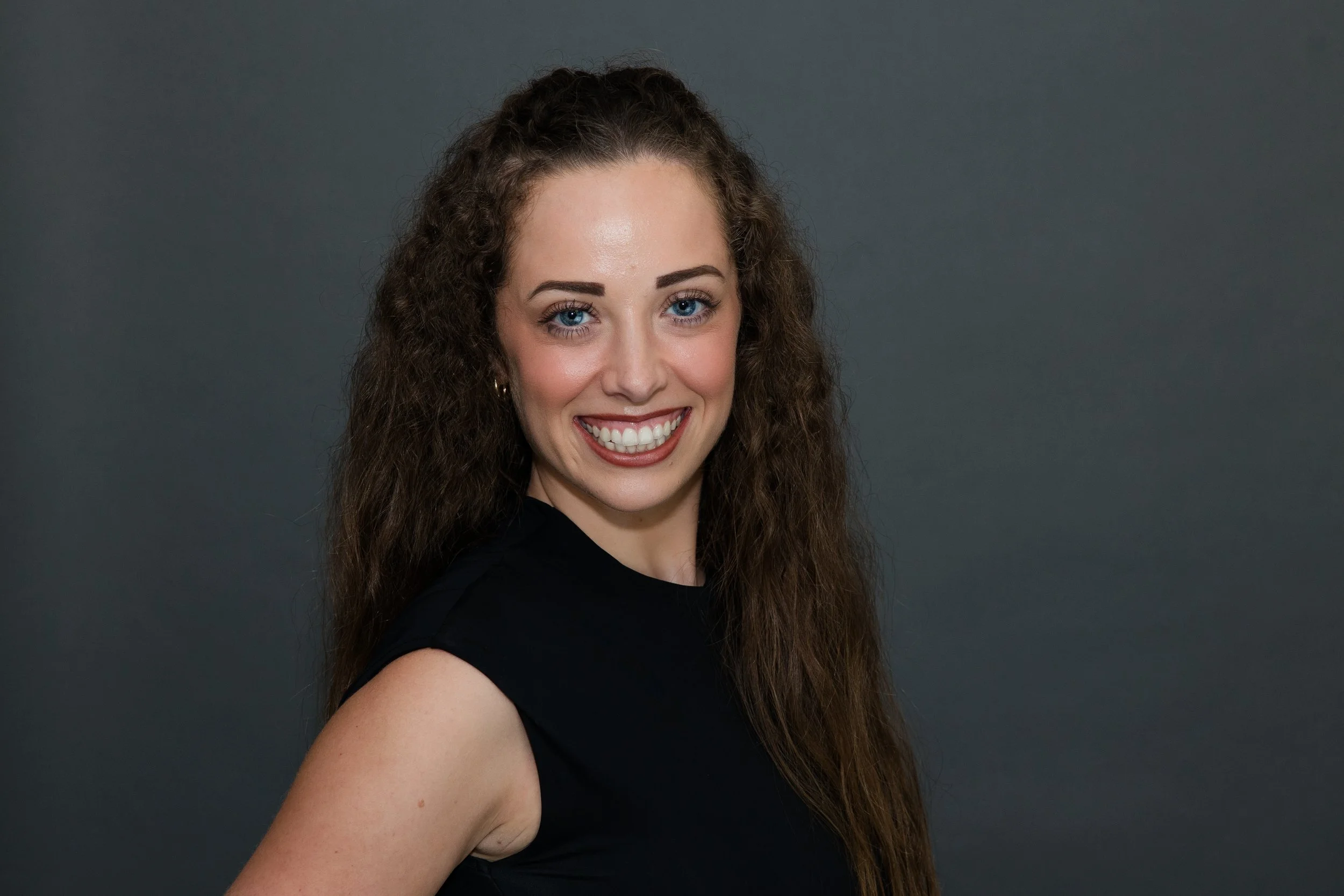 woman in black shirt headshot.jpg