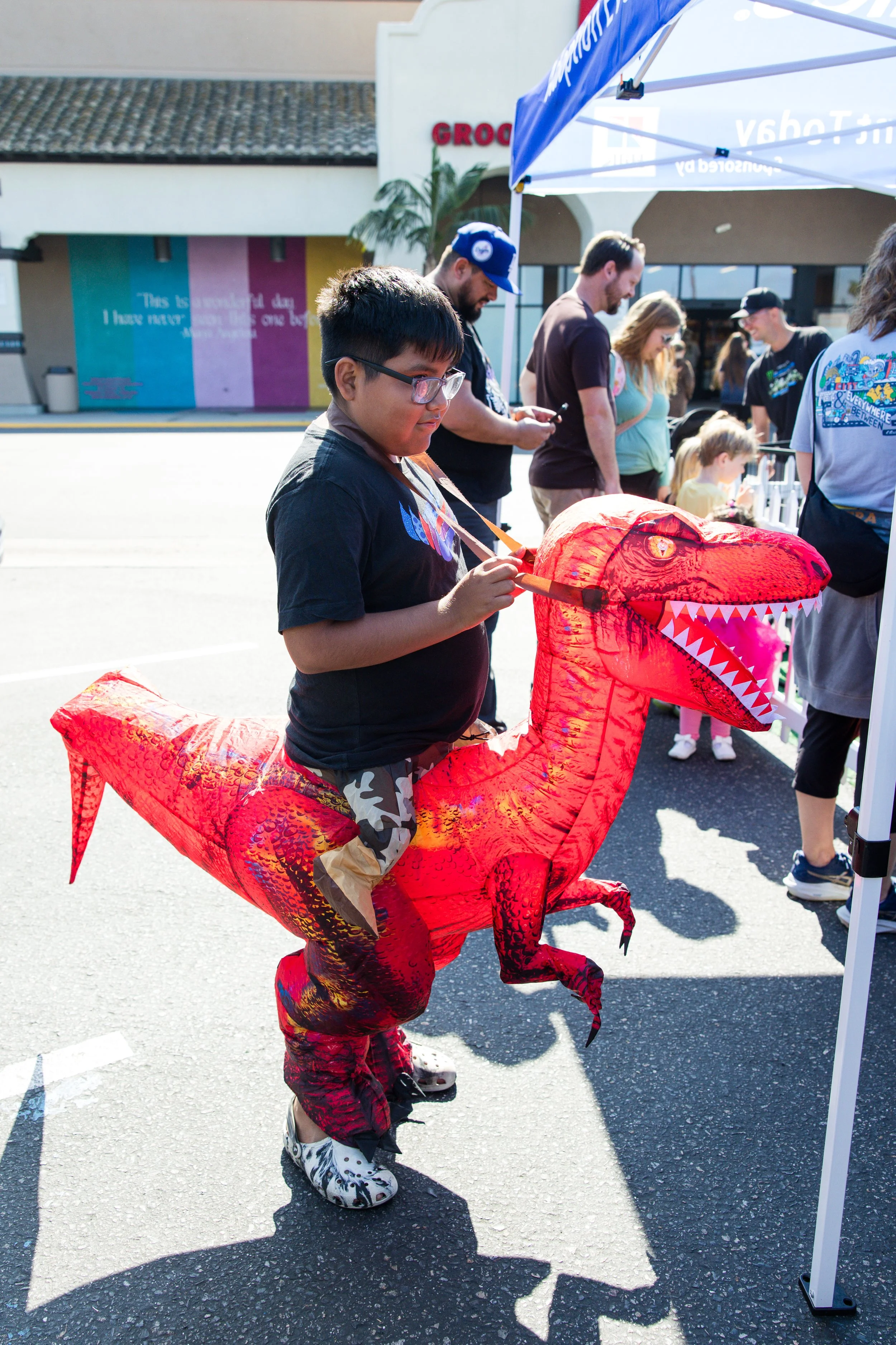boy in dinosaur costume