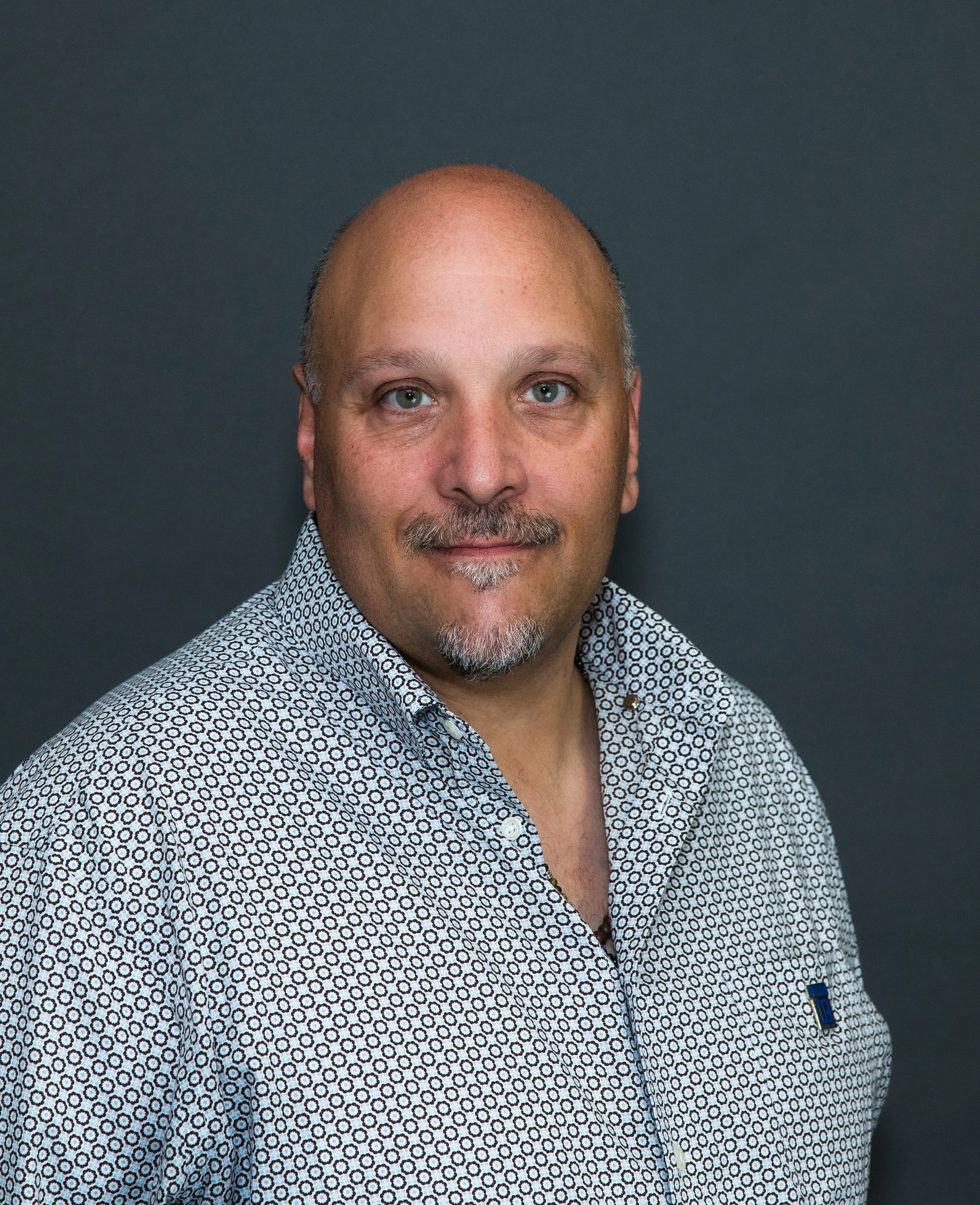 man headshot blue shirt.jpg