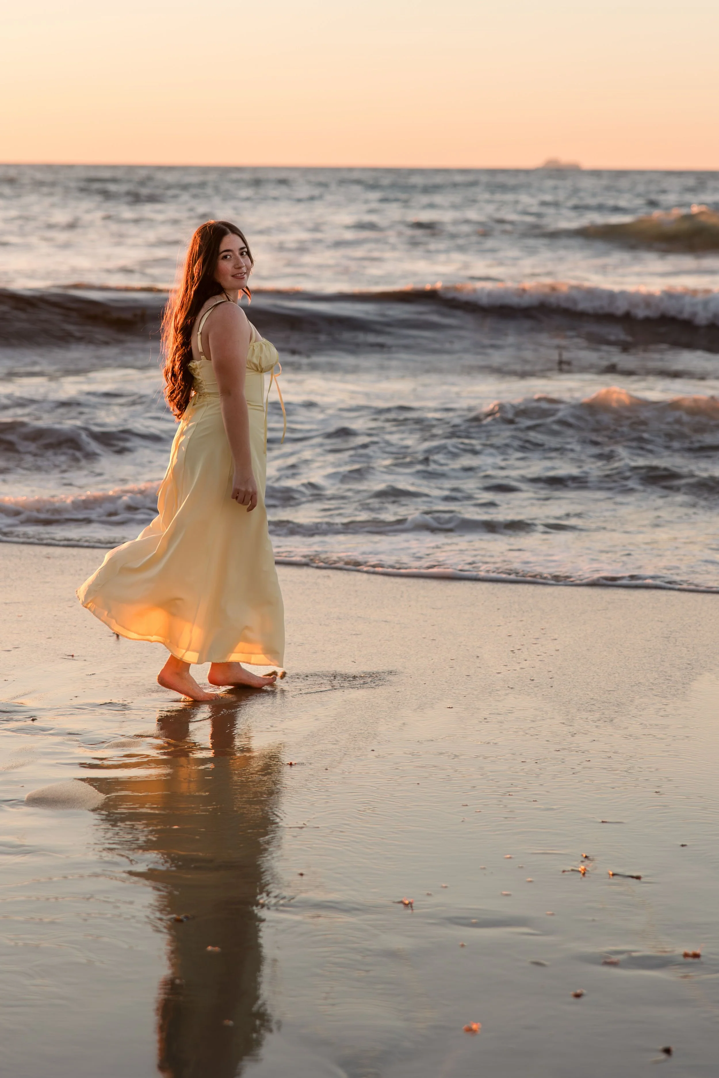 woman-running-ocean-beach-sand-smiling.jpeg