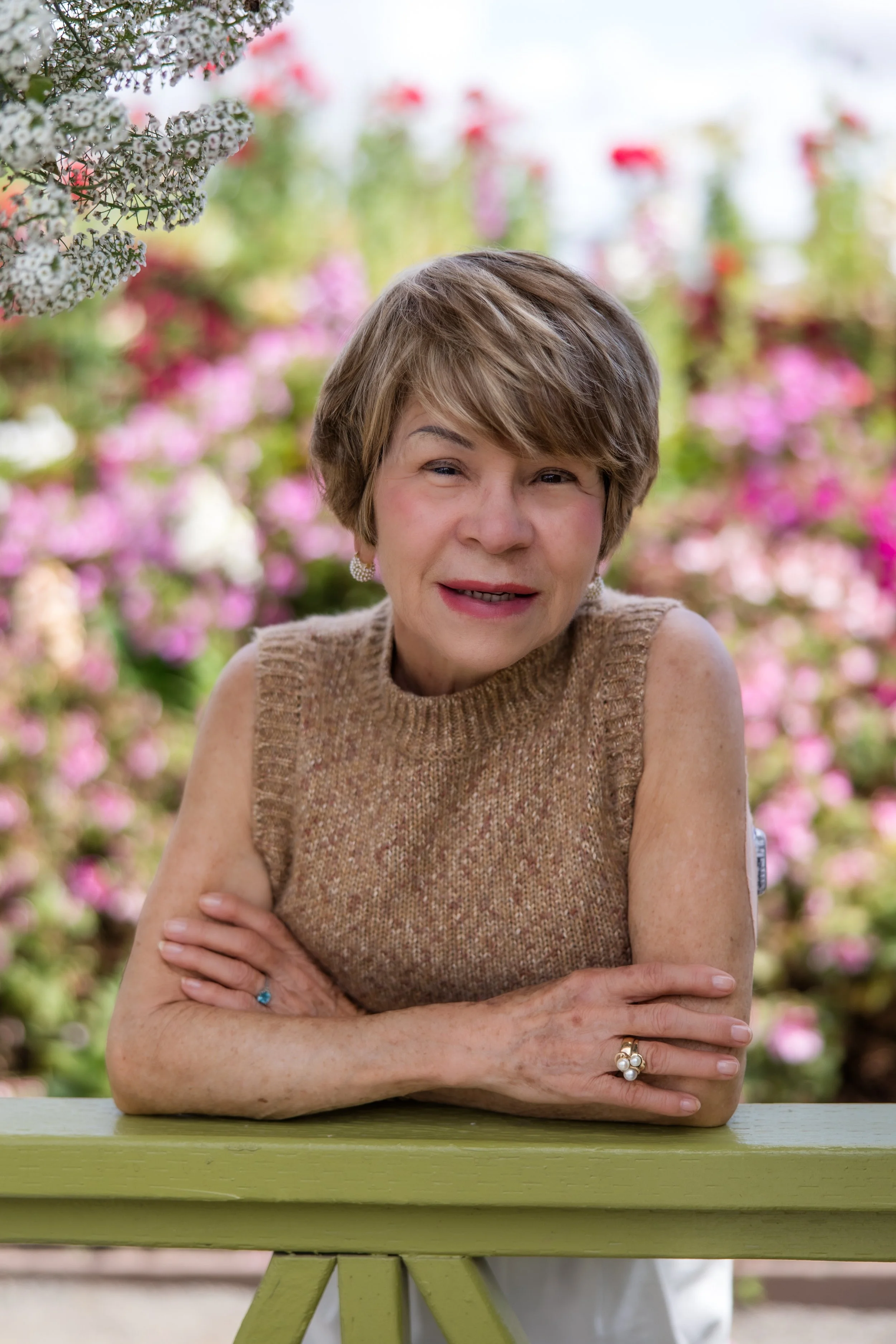 mature woman smiling with flowers.jpg