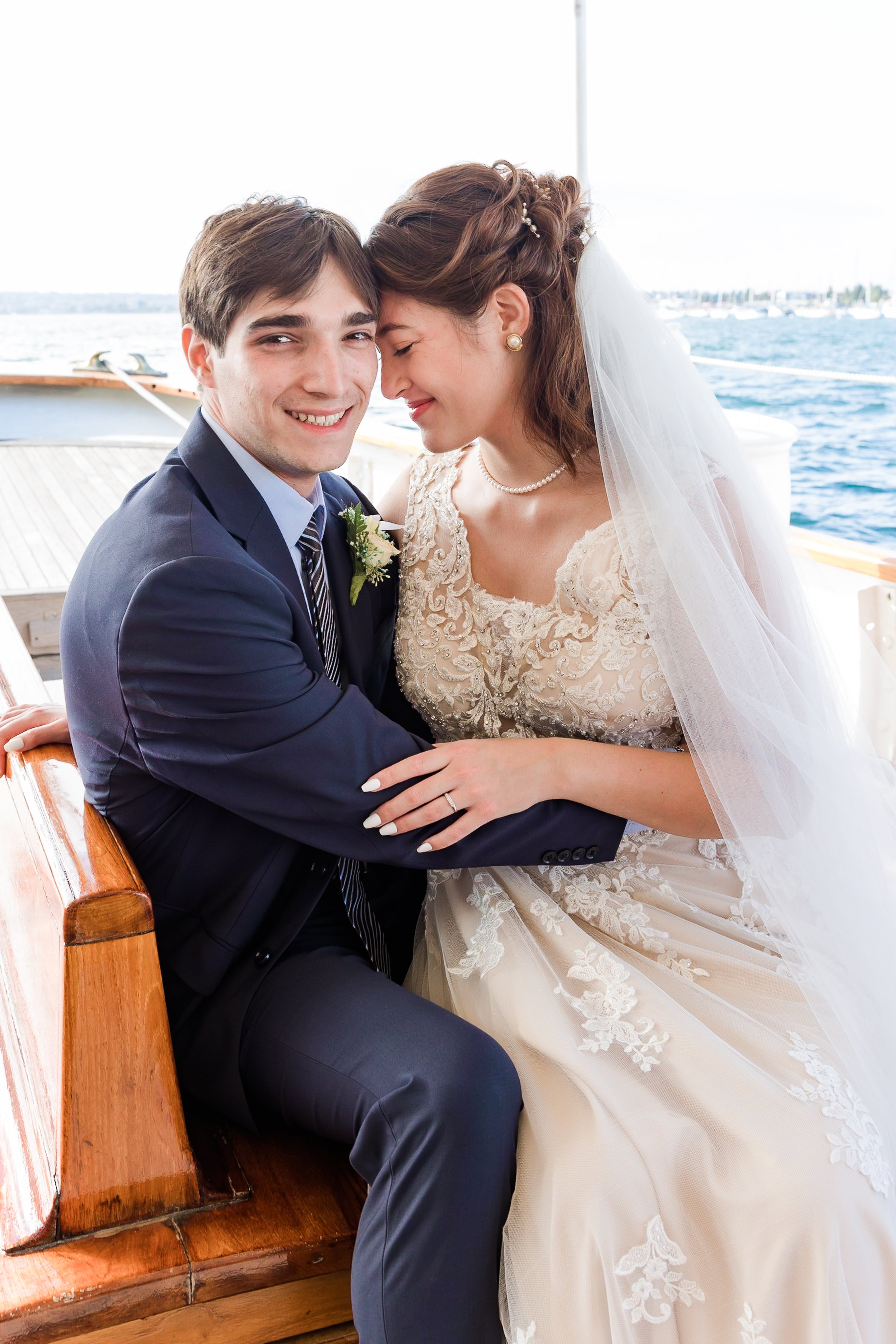 bride sitting on groom's lap