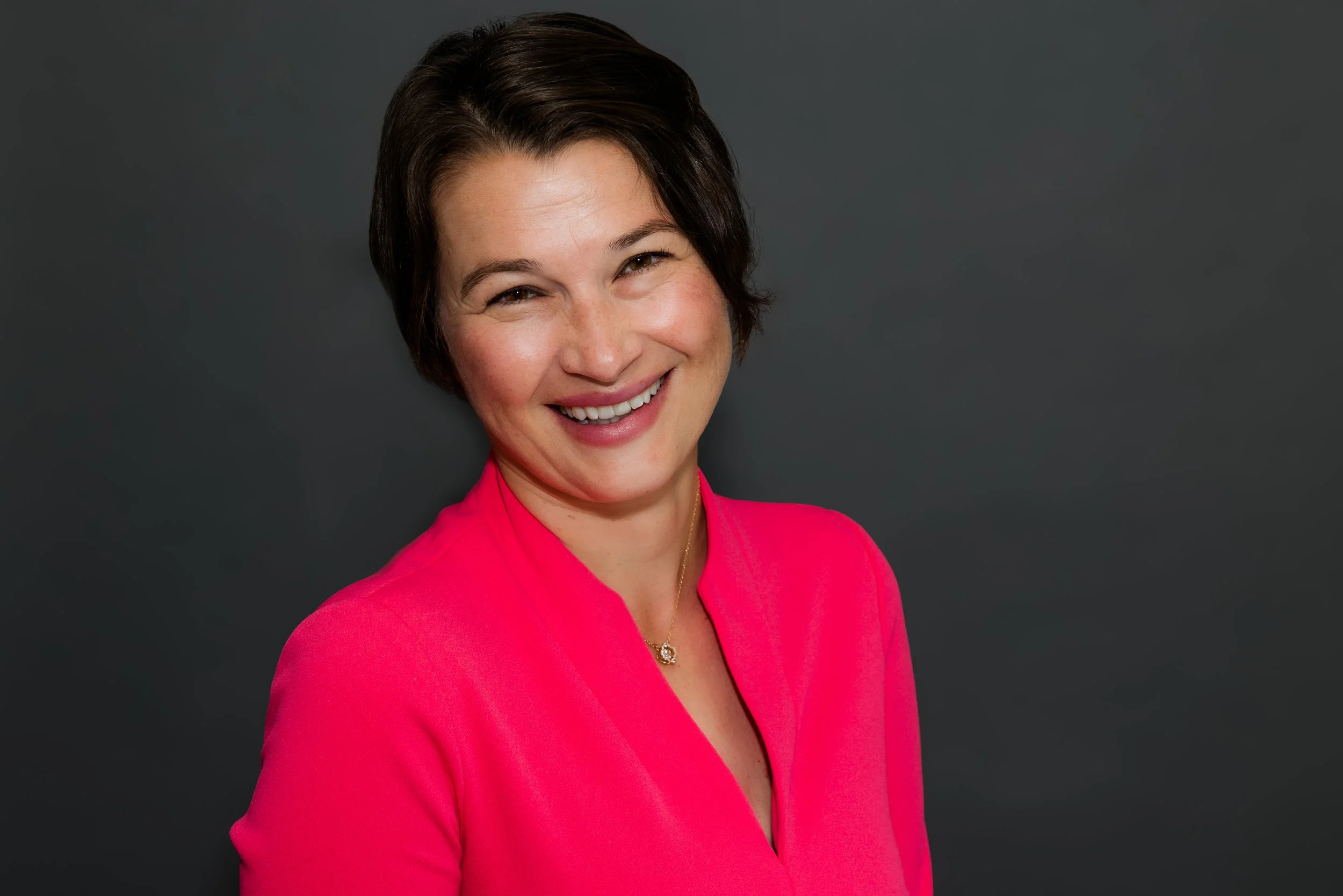 woman hot pink jacket.jpg