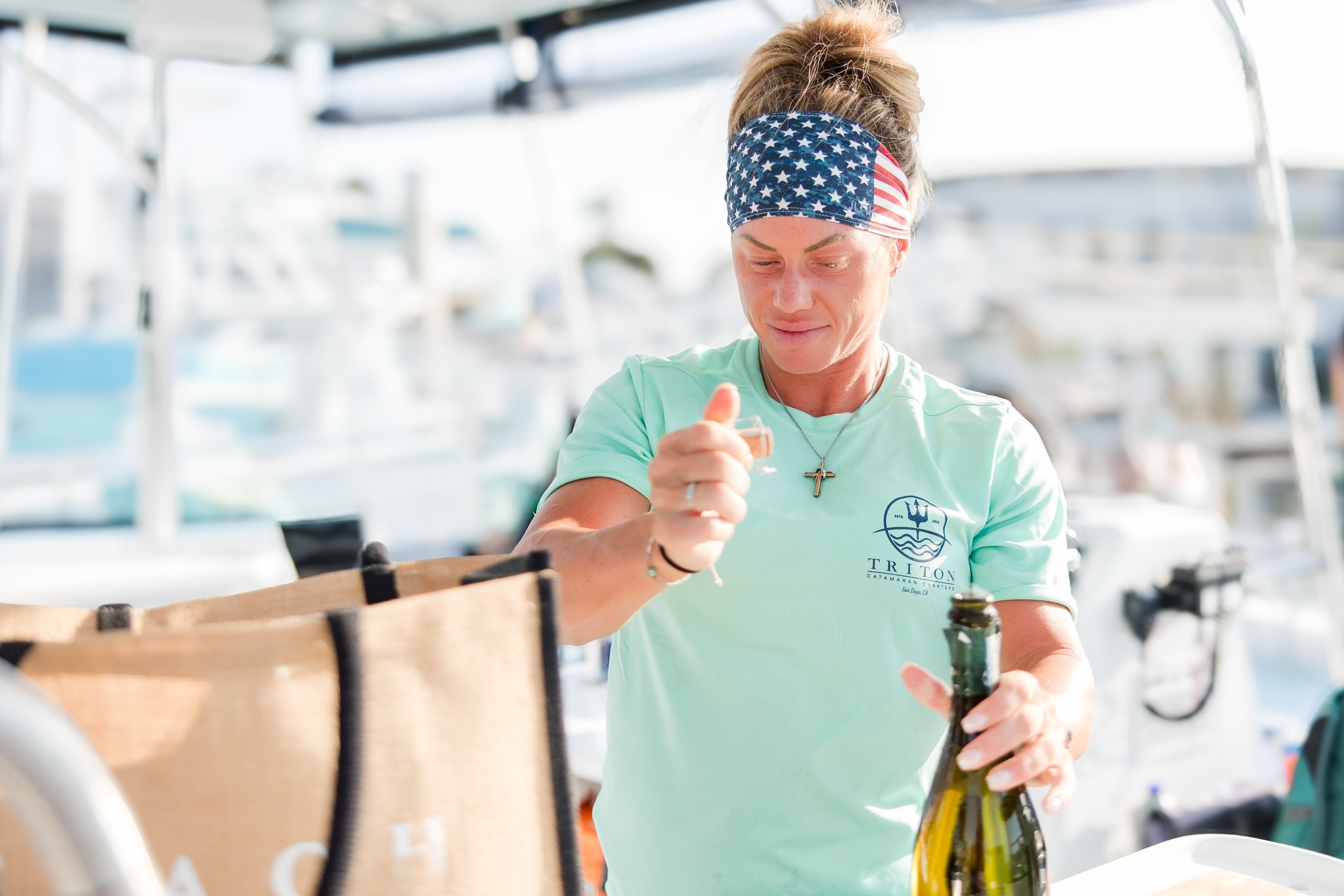 woman opening bottle of champagne