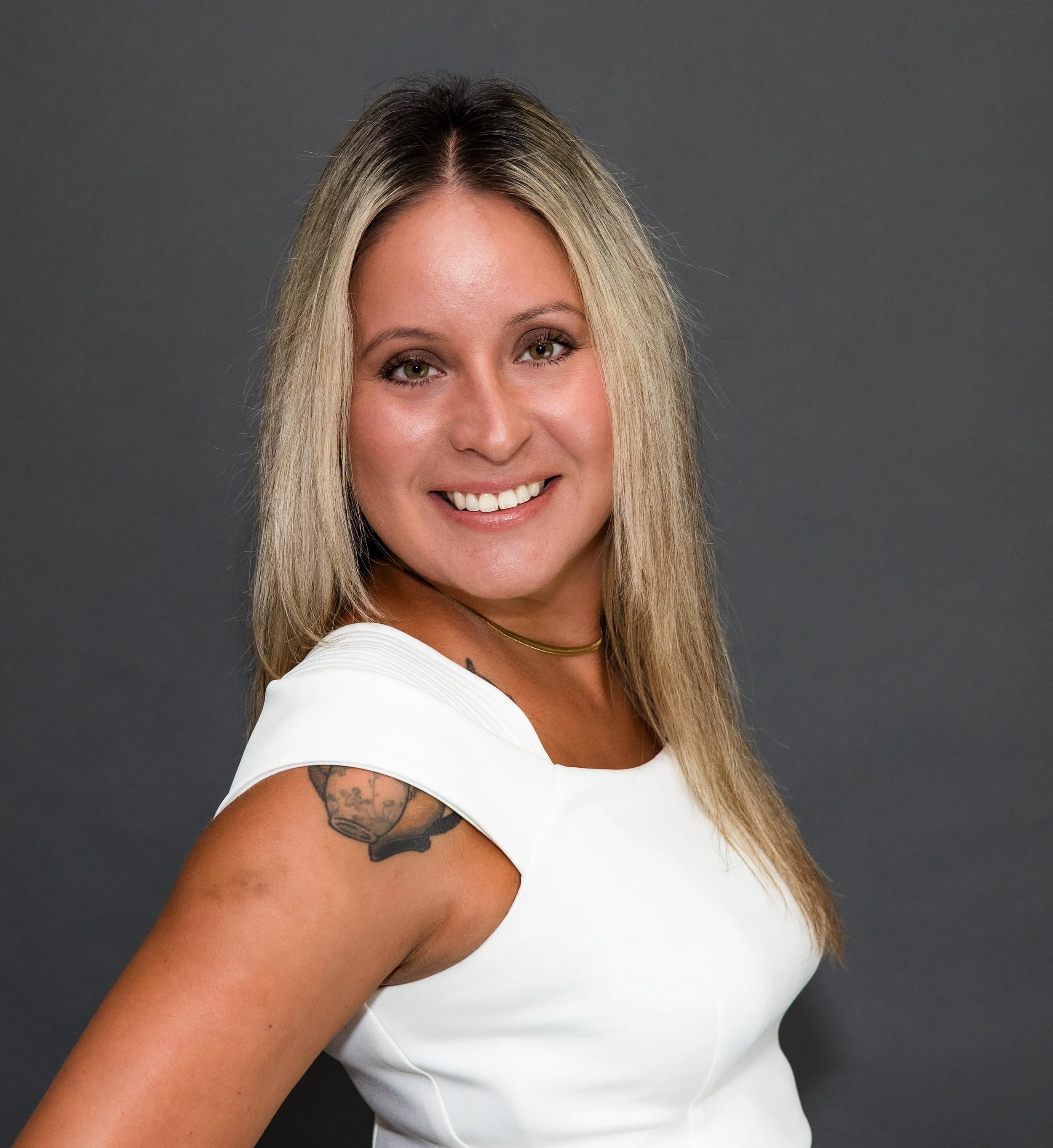 woman in white shirt headshot.jpg