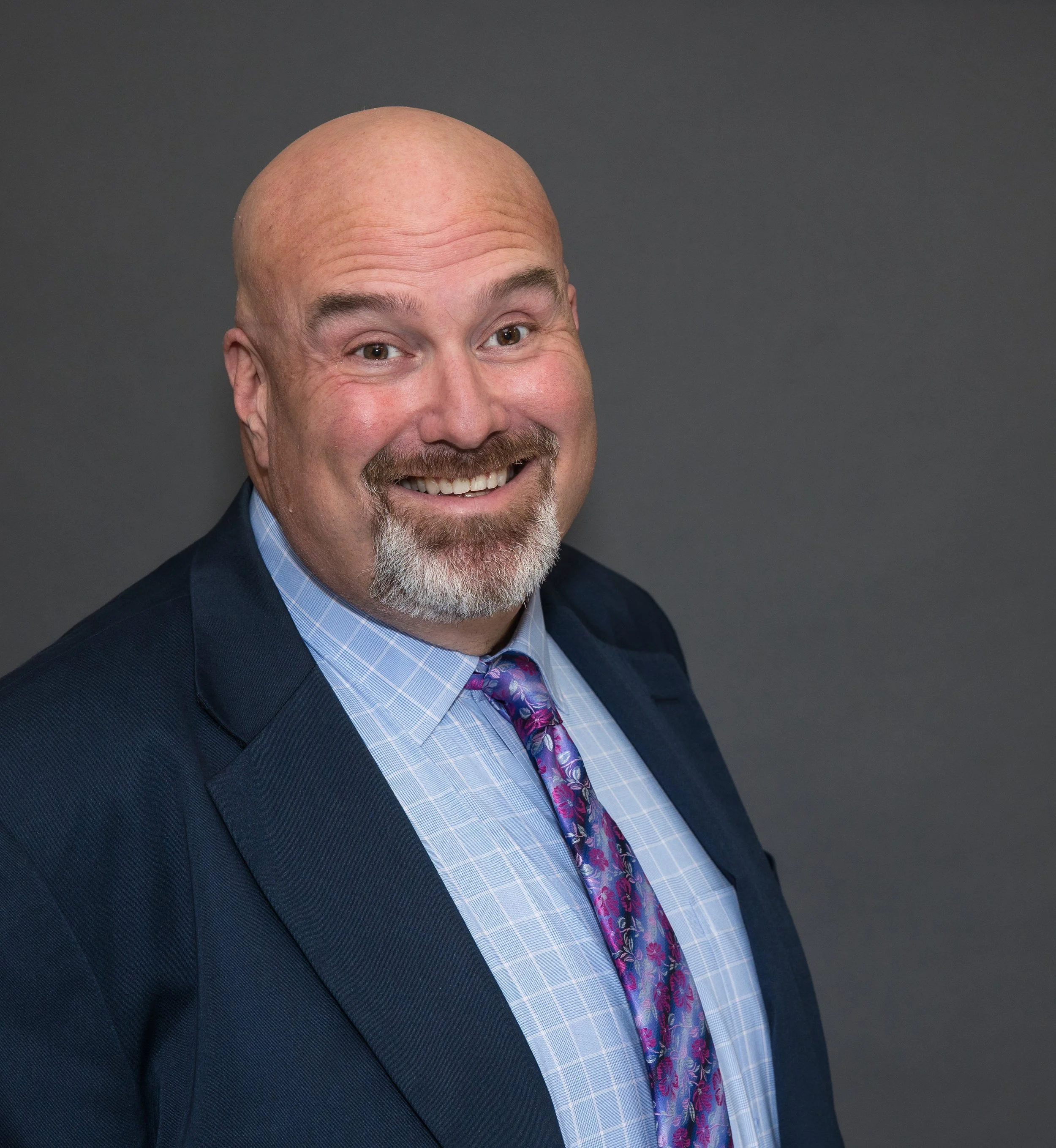 business man in suit headshot.jpg