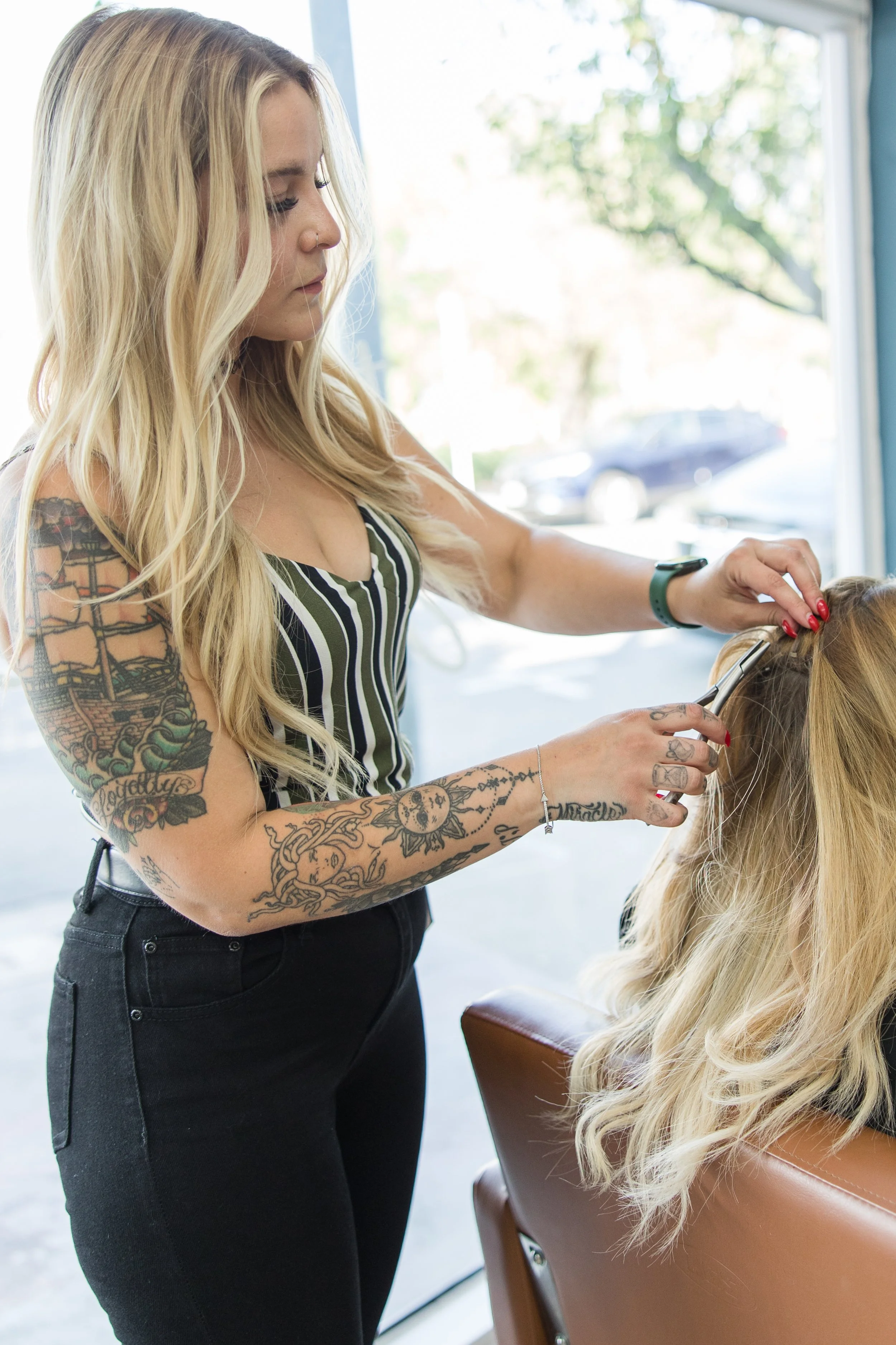 Woman cutting hair in a salon Sacramento