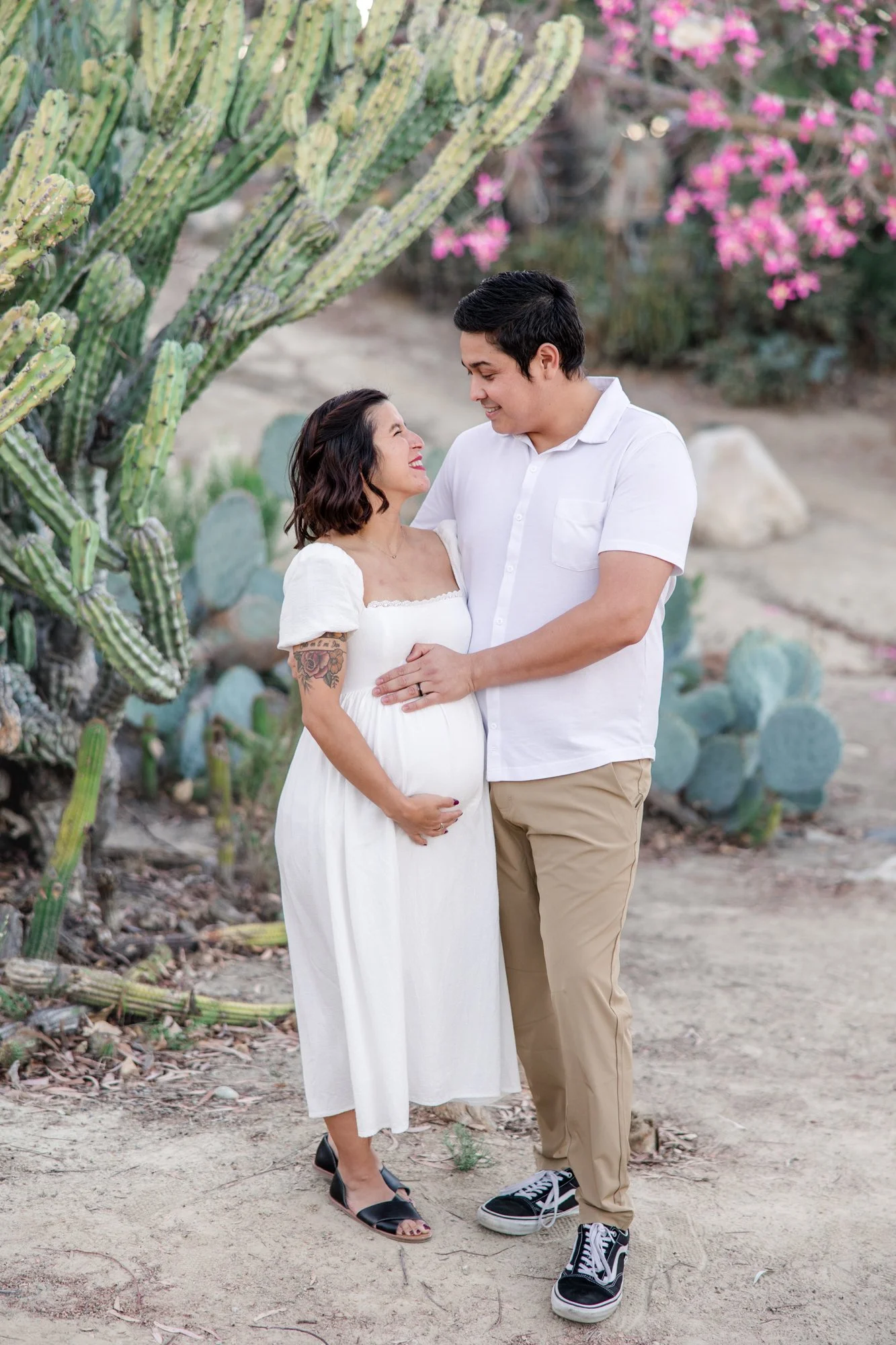 Couple smiling Balboa park pregnant