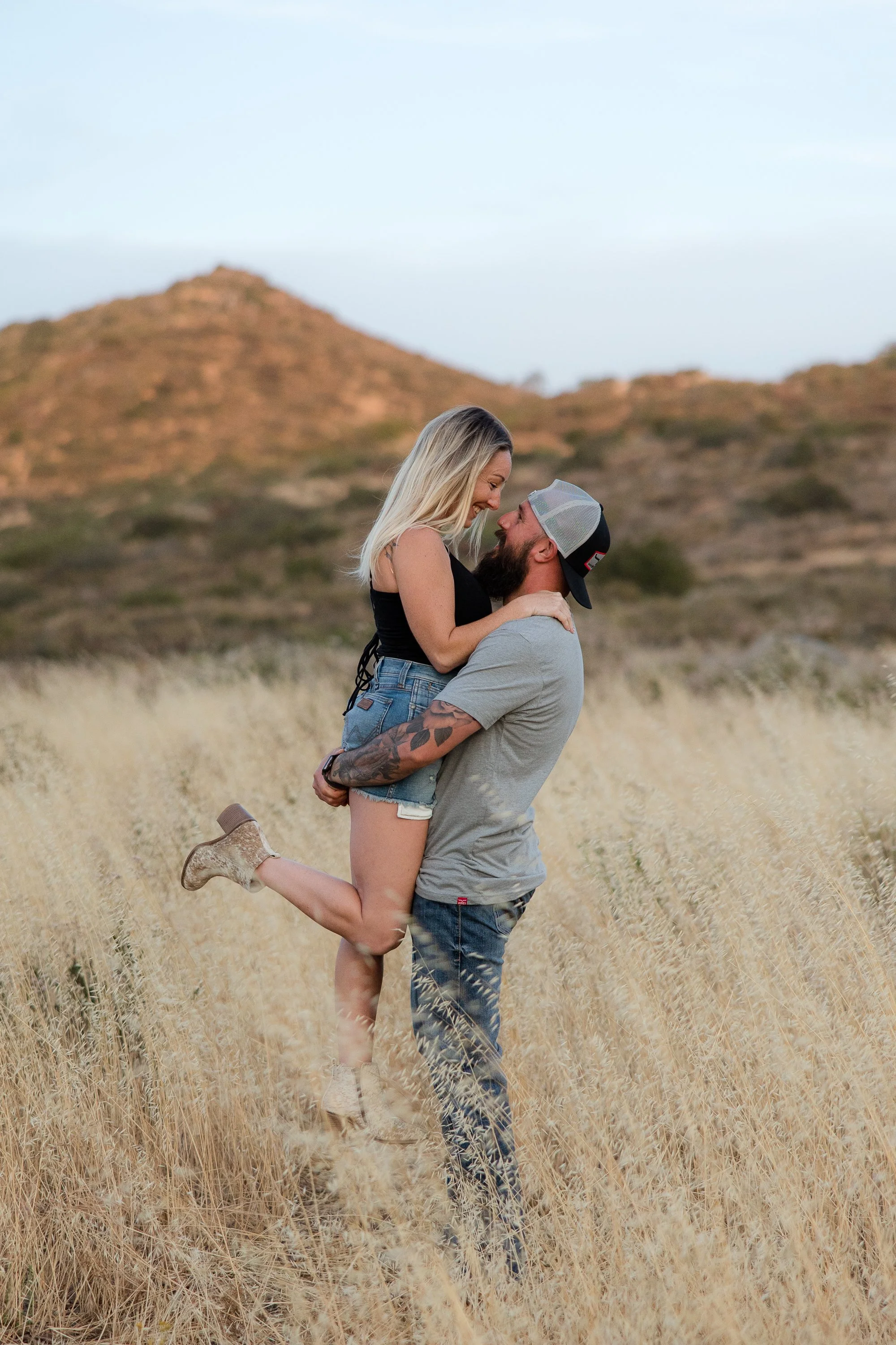 couple-picking-up-mountains-field.jpg