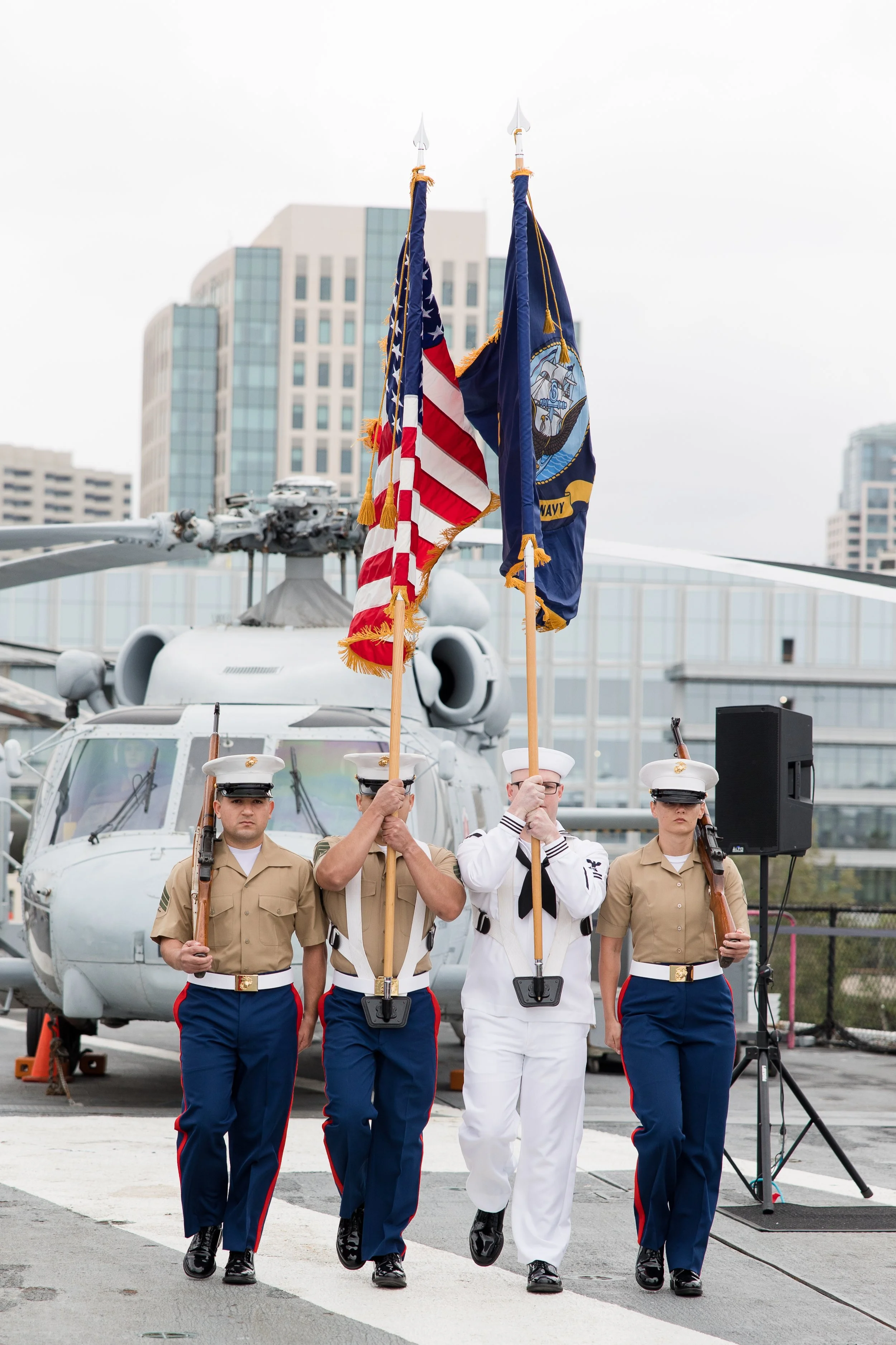 Naval officers carrying flag