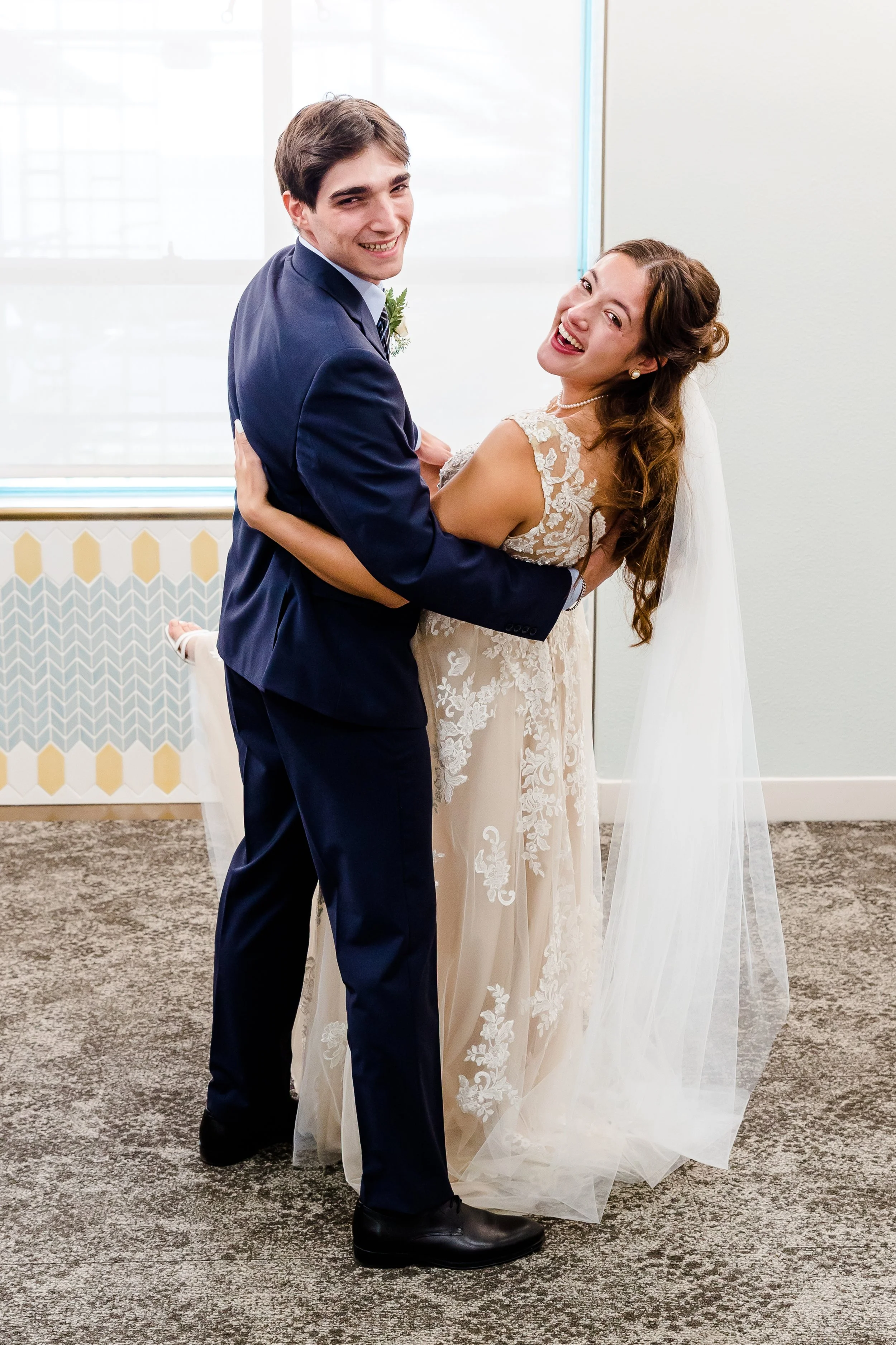 groom dipping bride San Diego courthouse wedding