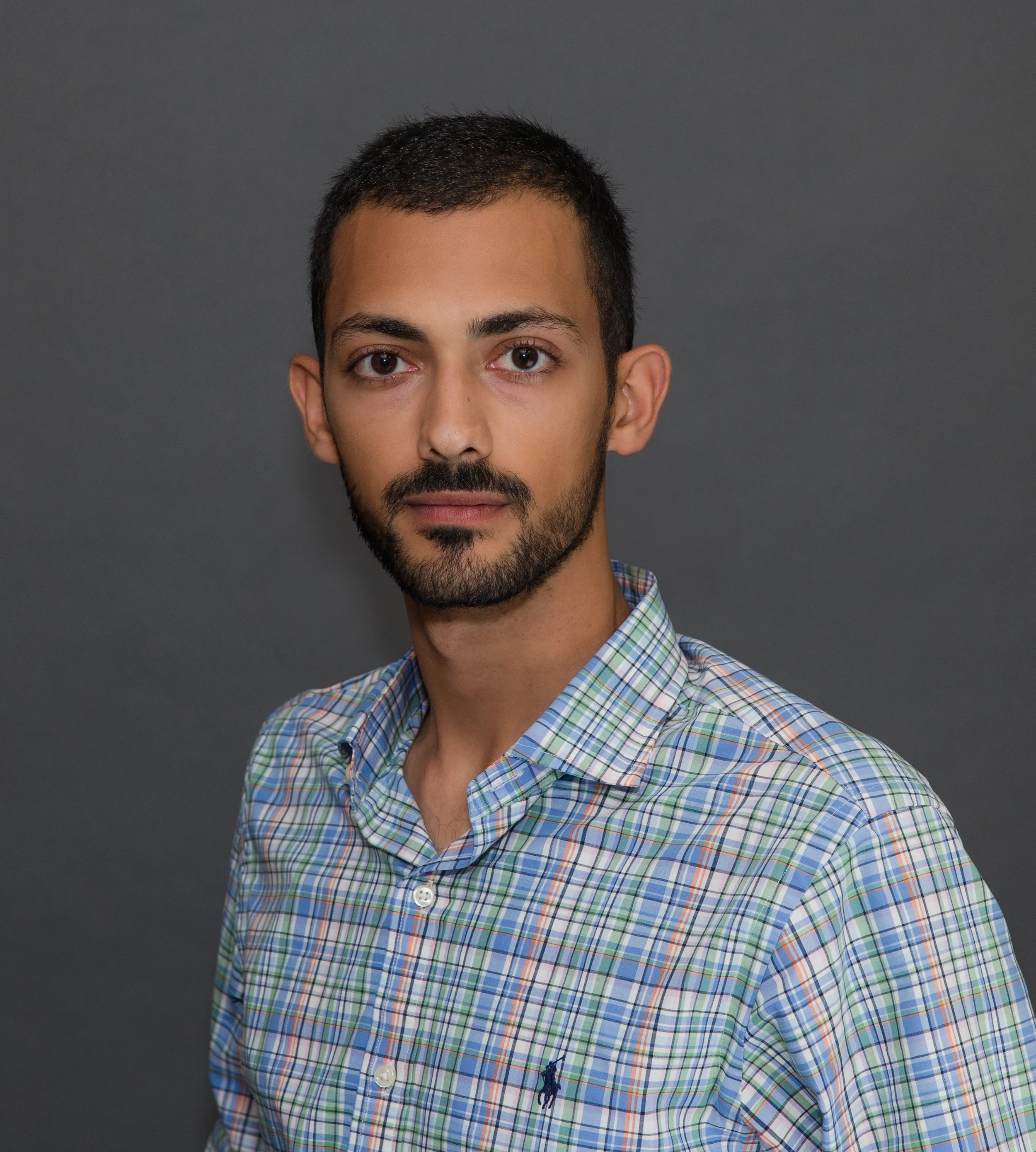 man pattern shirt headshot.jpg