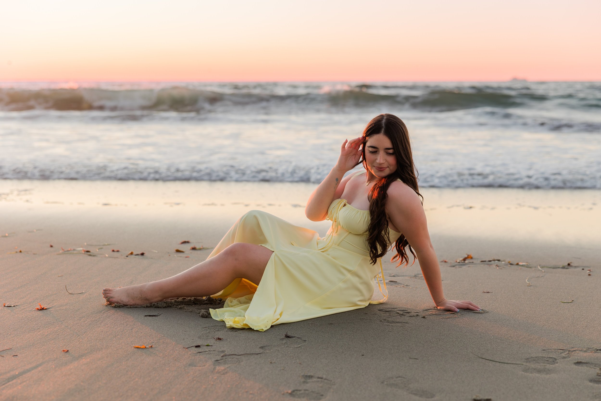 woman-laying-yellow-ocean-beach.jpeg