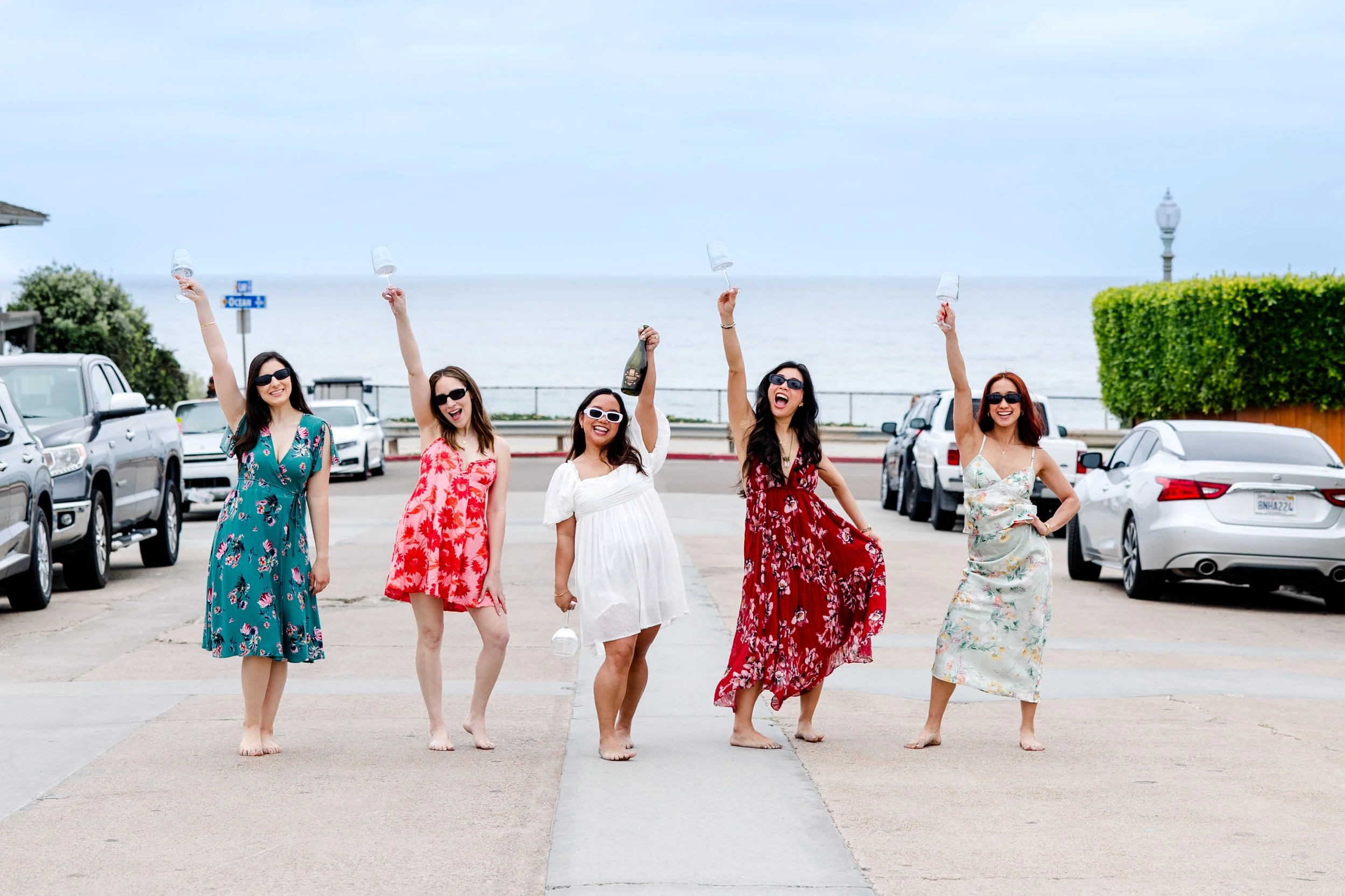 women posing near beach