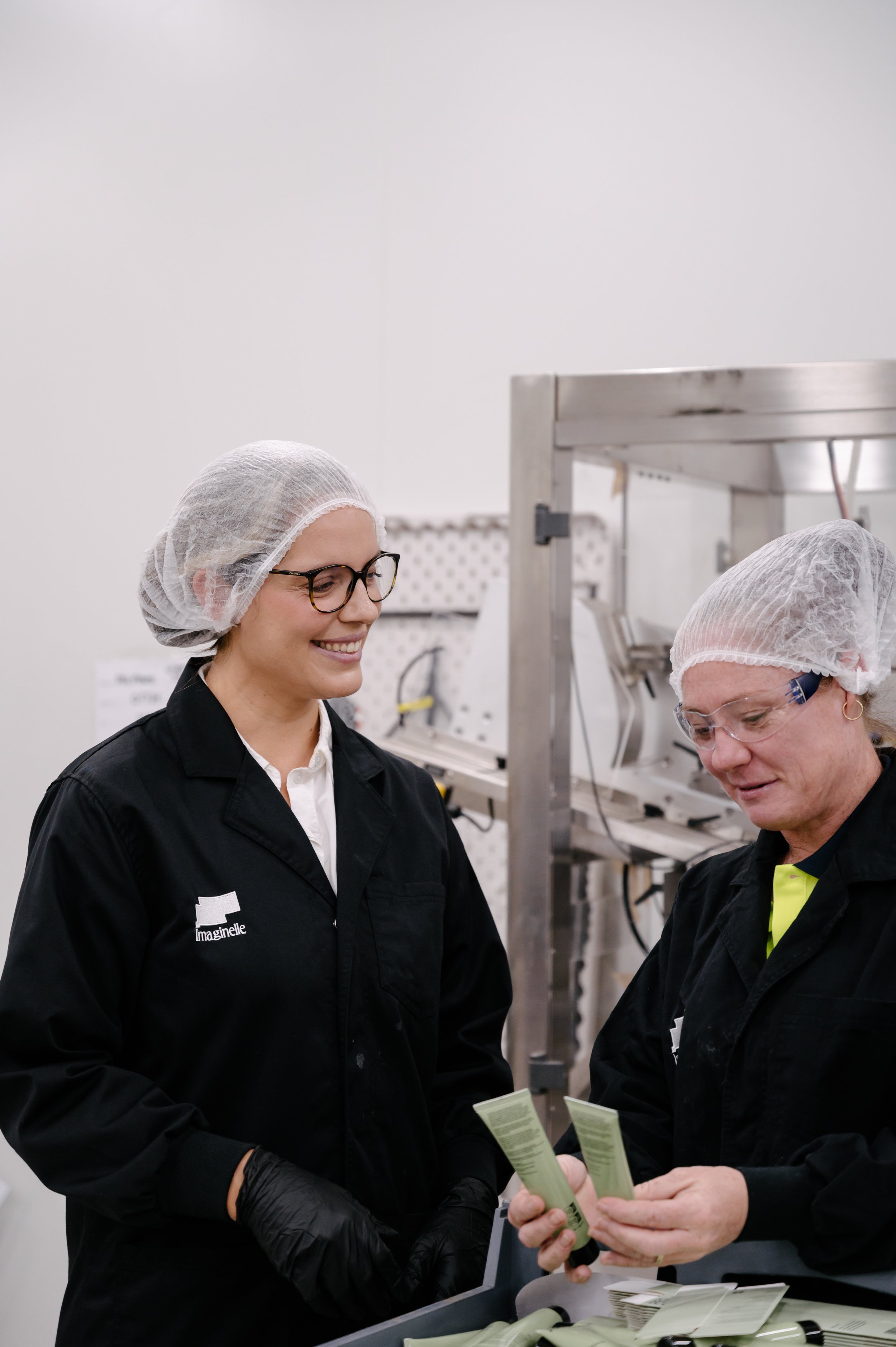 Australian contract manufacturer Imaginelle production team reviewing a toothpaste tube