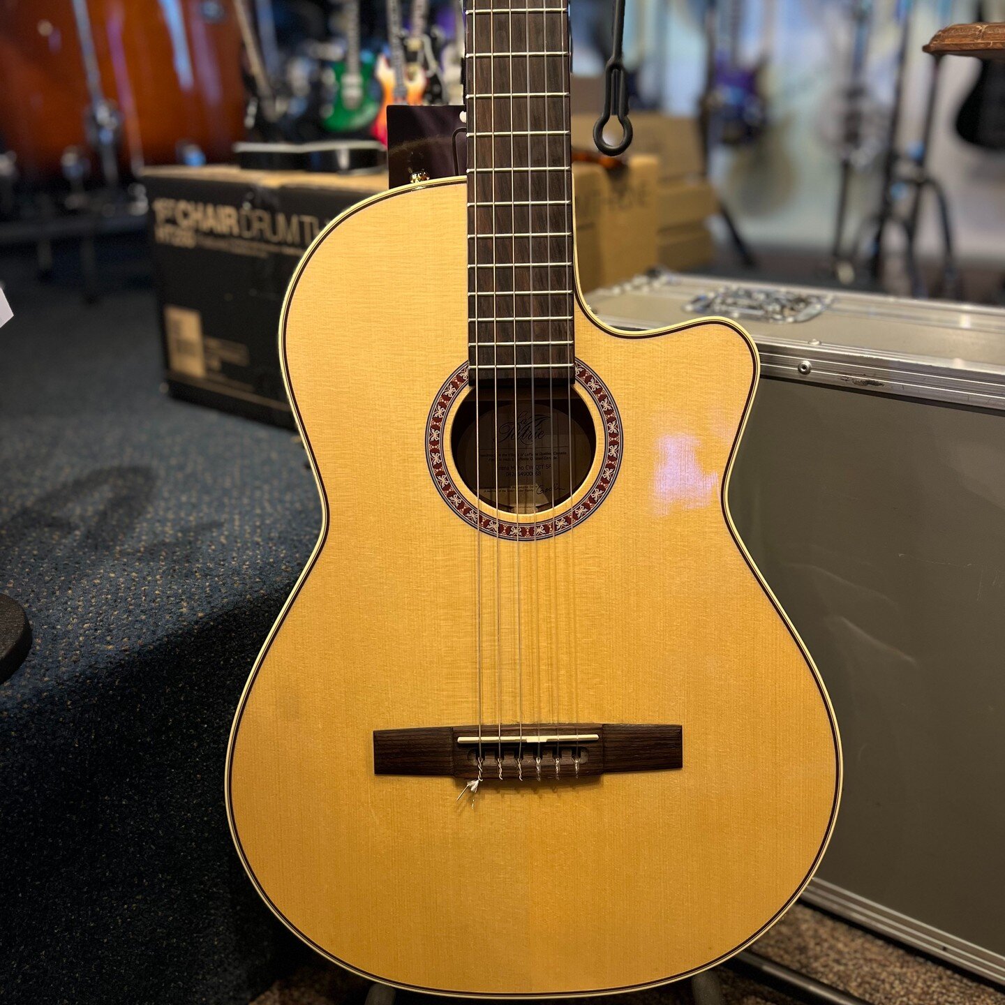 Just in, used. Great condition. Made in Canada by Godin, this la Patrie Arena, with pickup, has a much thinner body than a normal classical guitar. It has amazing loud and beautiful tone, with lots of low end and a beautiful even sound. Solid top, of