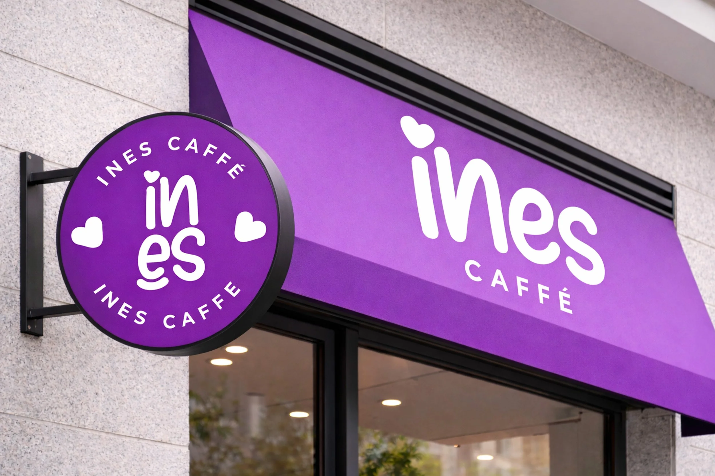 Ines Caffe storefront signage mockup featuring a bold purple awning, round café sign and white heart logo branding.