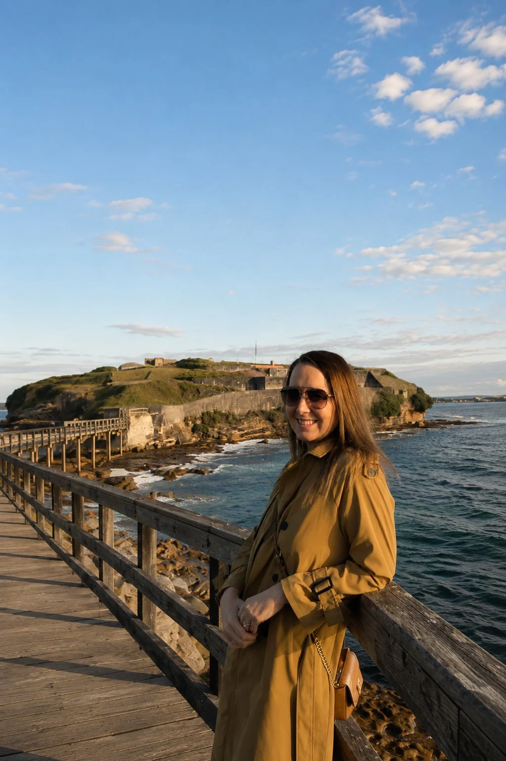Person standing on Bare Island Bridge at La Perouse, Sydney, reflecting on the coastal landscape that inspires timeless brand design.