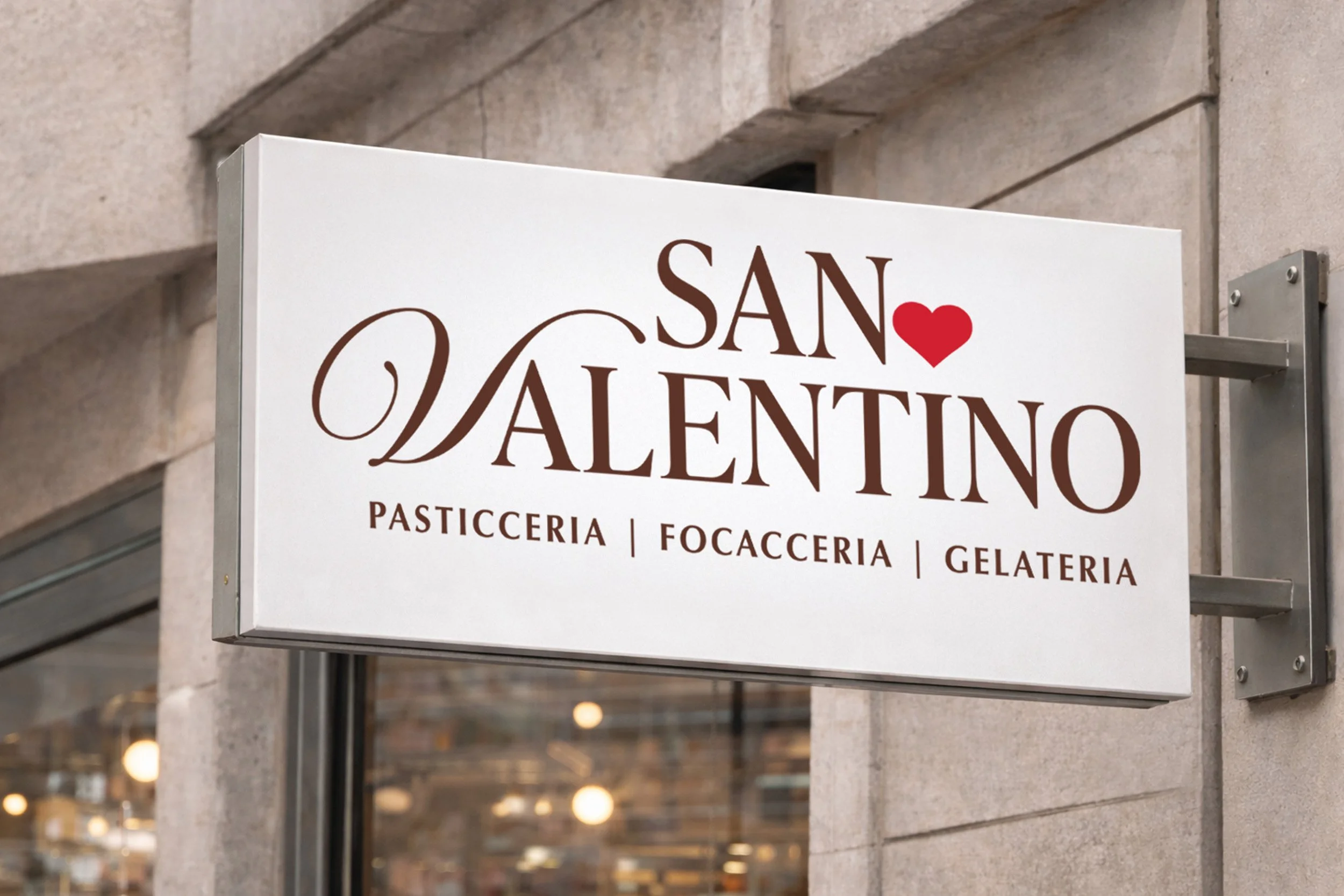 San Valentino Pasticceria storefront signage mockup featuring the logo on an exterior lightbox sign for a pasticceria, focacceria and gelateria.