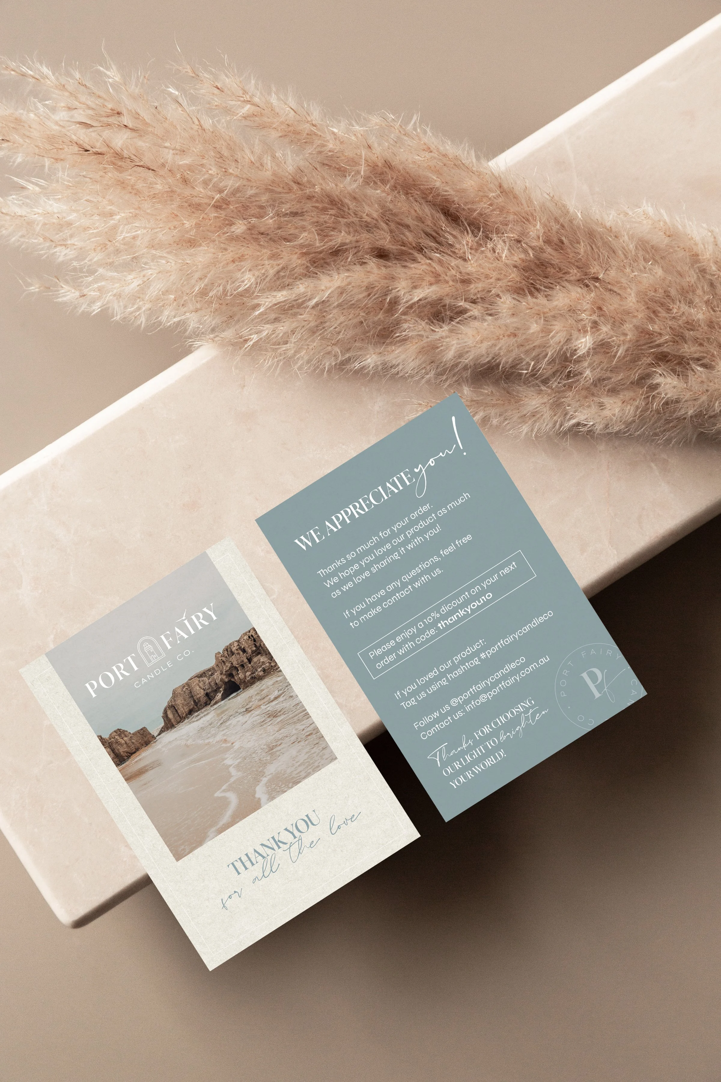 Port Fairy Candle Co. thank you card mockup featuring branded customer appreciation cards, coastal imagery and soft natural styling with pampas grass.